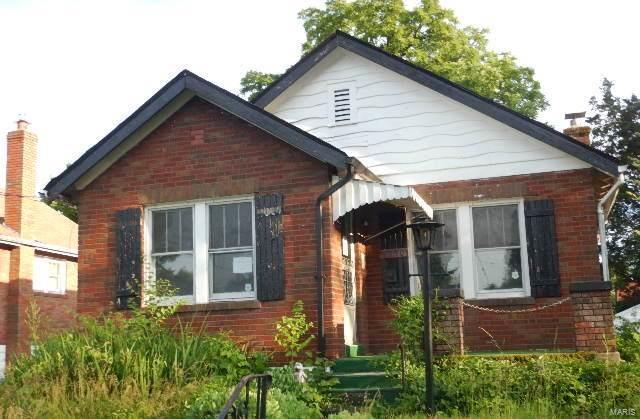 Brick bungalow with both formal living and dining room, 2 bedrooms and a detached garage.  This home has charm with it's arched doorways, ceiling fans, and original tile in the bath.  It's potential is shining through.  The basement is partially finished and adds another partial bath which is convenient.  Take a look because it's an opportunity you shouldn't pass up. SpecialListingConditions: Foreclosure