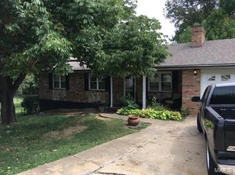 Cute, well maintained home with city utilities. Home features large lot, and screened in back porch to enjoy your evenings in a quiet neighborhood. Garage has been converted to a recreational/bedroom for a growing family, but can be converted back to a garage. Ready for your single family/investment needs.