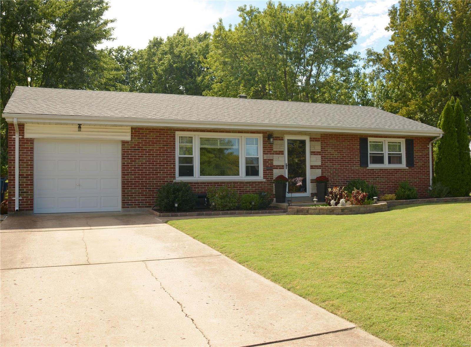 This is a really charming home in a great neighborhood. The neighborhood is one of the things they will miss the most. The home has nice updates and has been meticulously maintained. The exterior has new landscaping, 2 yr old  roof, windows, sliding glass door and concrete patio. The garage door is brand new. The back yard is level with grapevines, and other perennials. The interior has very youthful décor. There is gleaming wood floors, and newer tile with hard surface countertops in the kitchen. There is a half bath in the master bedroom; unheard of in this price range. The bathrooms have been updated with new tile and vanities. The lower level is spacious, unfinished and dry! The sellers hate to go, this home has it all and is turn key ready.