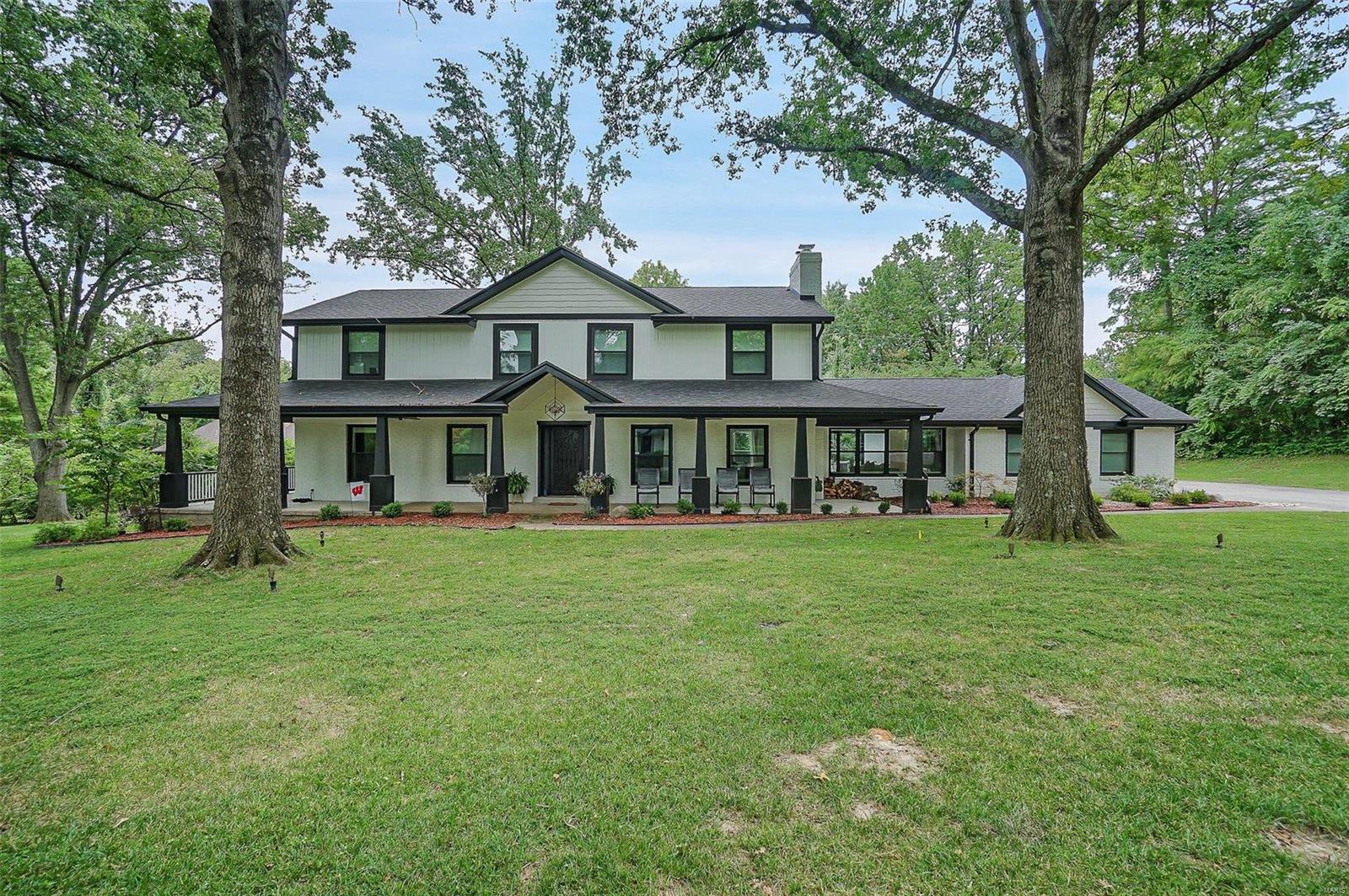 Meticulously maintained and elegantly designed newer 4 bed, 6 bath newer construction in the highly sought after Ladue School District! This home has over 4,500 SF of living space & sits on a corner lot in a quiet neighborhood. Details throughout the home include beautiful wood flooring, wainscoted walls, 8+ ft ceilings, 2 woodburning fireplaces, main floor laundry & 3 car side entry garage. The remarkable kitchen boasts stainless steal appliances, custom white cabinetry w/ hidden walk-in butlers pantry, oversized center island, double oven & custom tiling. Main floor master has its own suite with raised height double bowl vanities, large soaking tub and separate walk-in shower. The master also has its own access out to the private porch. Living room, dining room & den all on the main level giving plenty of space to spread out. The upper level has 3 great size bedrooms with their own full baths! Lower level is finished with a family/rec/gym area & still has plenty of room for storage. COOL: 14 SEER+