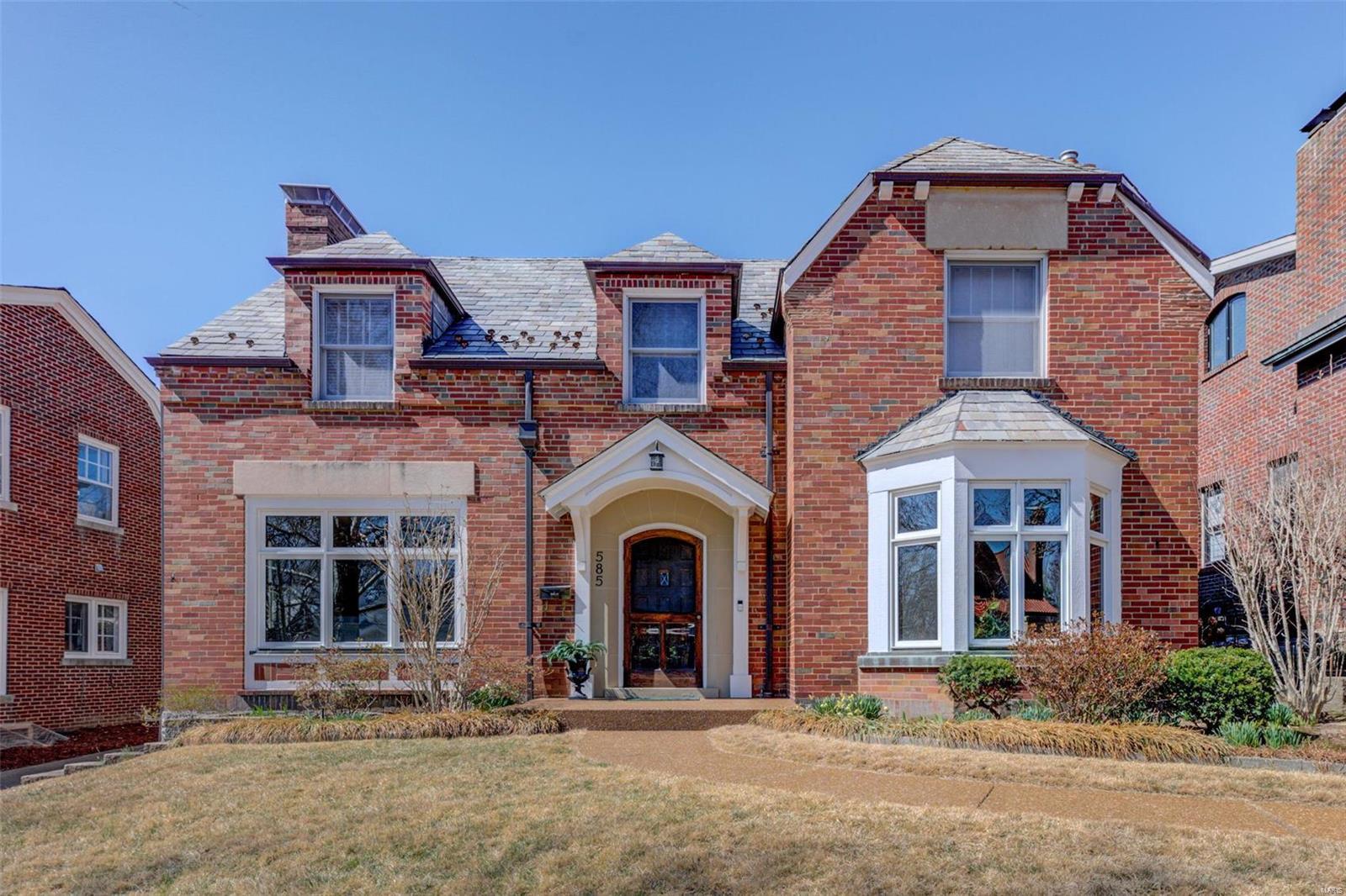 This updated University Hills home has the best of both worlds-quality modern amenities combined with original architectural details. Outstanding curb appeal, crown molding, rich wood floors, bay window, two fireplaces, ceiling medallions, built-in shelves, and a gorgeous domed ceiling with recessed lighting on the second floor landing. Adjoining room with a built-in desk located btw the updated kitchen & dining rm and would be a nice office or breakfast rm. The opposite side of the kitchen has several rooms open to each other, including another breakfast rm option, a family rm, & an office or mudroom. The second floor includes a master bedroom w/ensuite bath & private light-filled sunroom/sitting room, plus two more spacious bedrooms with an updated "Jack and Jill" bathroom. More living space in the finished lower level recreation room with dry bar & fireplace, a bonus room, an additional finished area, and a half bath. Professionally landscaped fenced yard with patio.  2-car garage. Additional Rooms: Mud Room, Sun Room