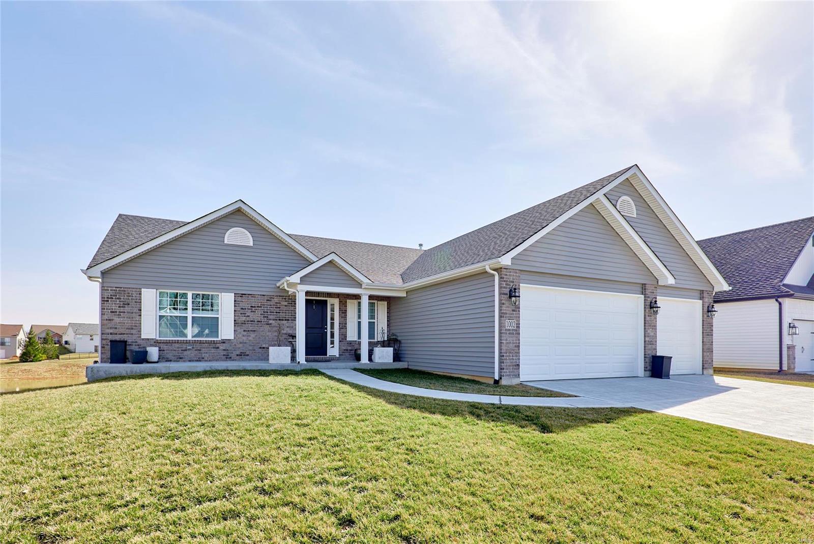 Come check out this gorgeous one year old home tucked in the most charming street of St Charles County. Convientently located on the northern side of the desirable city of Wentzville and only 2 short minutes directly to Highway 61. This home boasts with a welcoming open floor plan and large vaulted ceilings. It will draw you in through the details: elegant choice of lighting throughout, spacious kitchen (featuring quartz countertops), coffered ceiling in master bedroom, walk-out basement, 448 square foot patio for entertaining, and a gorgeous view that backs to common ground. Act quickly, this one won't last long!