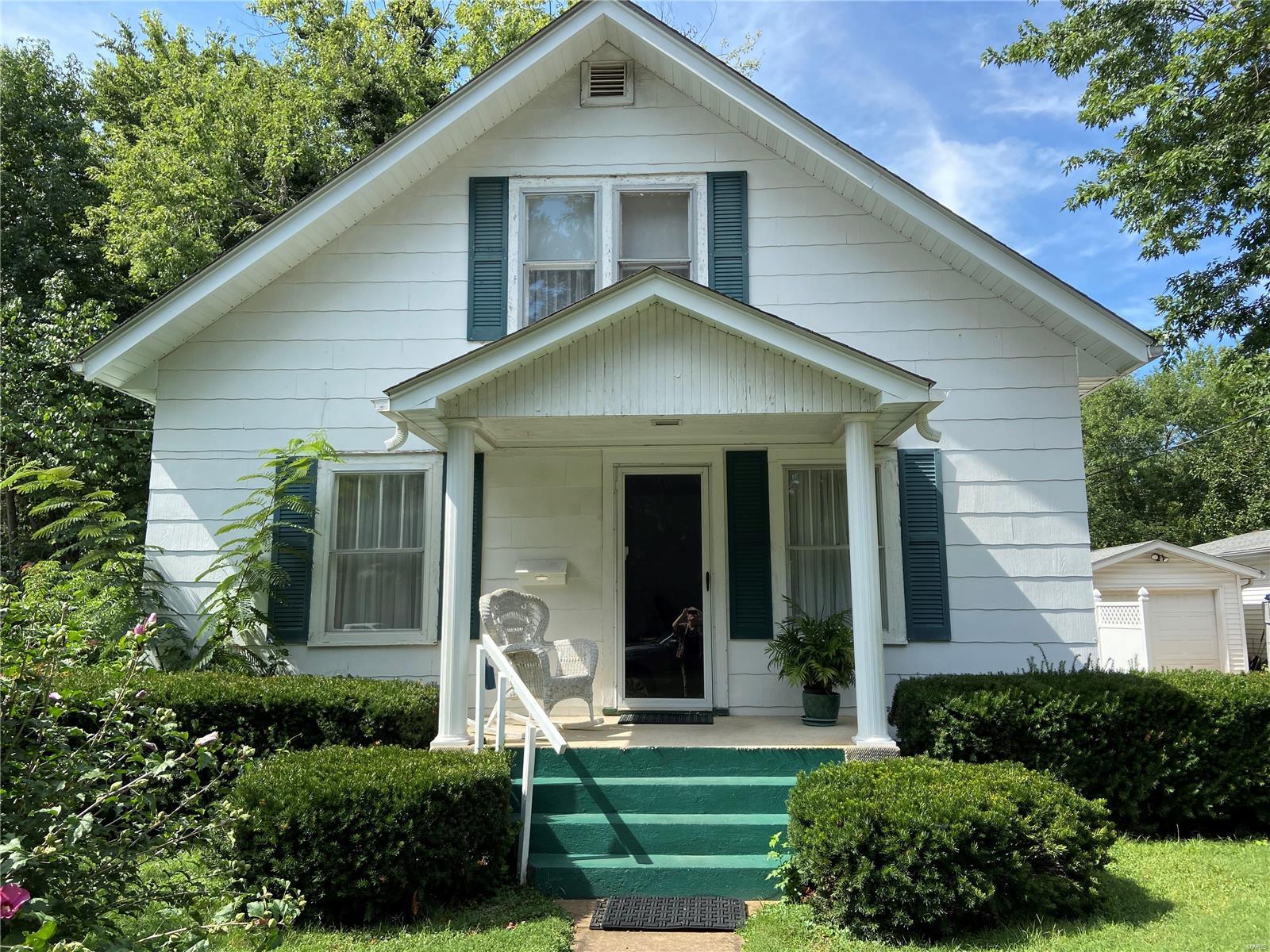 Great opportunity to enjoy a vintage home with lots of potential.    Huge yard has numerous flowering plants for spring time pleasure. There are four bedrooms and 1-1/2 baths and with some updating, could be the perfect home for your family.    Call today for your private tour of this home.
