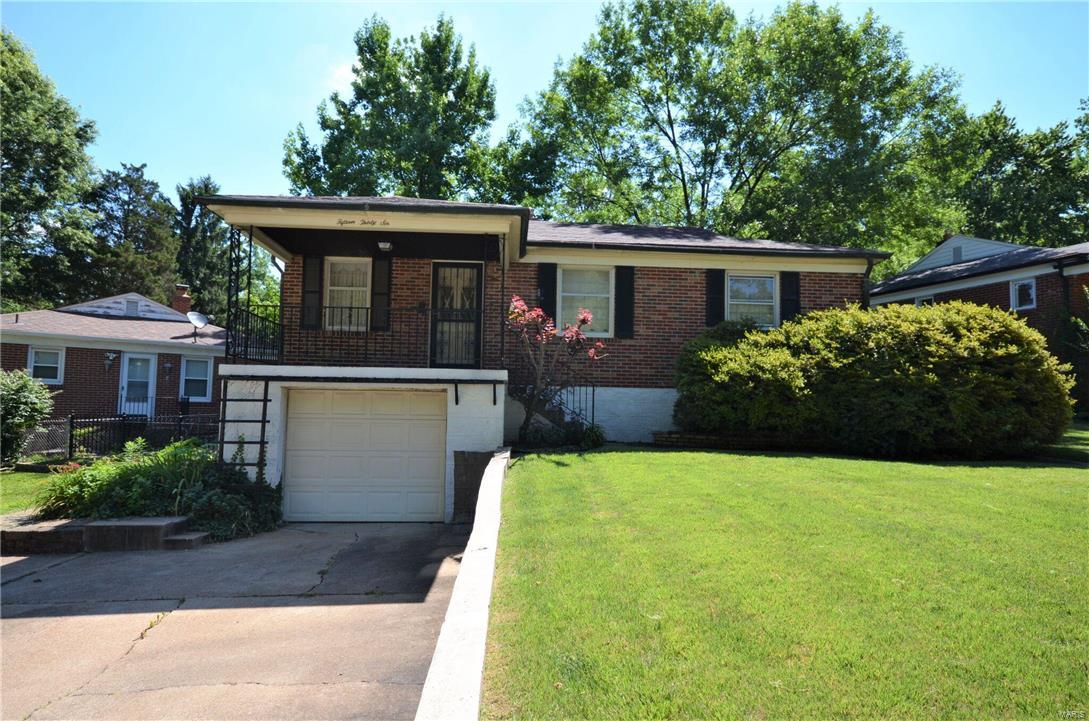 Diamond in the Ruff! All Brick Charmer nestled in a great location within minutes of everything! This home sits on a beautiful level lot with a huge covered patio, stately wrought iron Florida Leaves fencing and side concrete sitting area. Inside step back in time and you find a large kitchen, dining/living room, 2 good sized bedrooms, and hardwood under all carpeting. Basement has another living space, gas fireplace, full bath and laundry area. There is a 1 car garage that could be used for a second smaller vehicle or as a bench/work space. Double parking driveway and covered front porch. Bring your ideas and transition this home to its prior glory! Property is to be sold "as-is". Seller will not provide any inspections nor do any repairs.