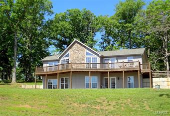 Must See Gorgeous Newer home with spectacular views of Lake Shayne!  Home features open floor plan with vaulted ceilings, Master bedroom suite and laundry on the main floor.  Living room has propane fireplace and walks out to a large deck.  Walkout basement has large family room and kitchen area with a refrigerator, dishwasher and sink including 7X11 storage area.  Terre Du Lac is a private community that offers access to 15 lakes, Tennis Court, Country Club, Golf and Pool.  Set up a showing today!