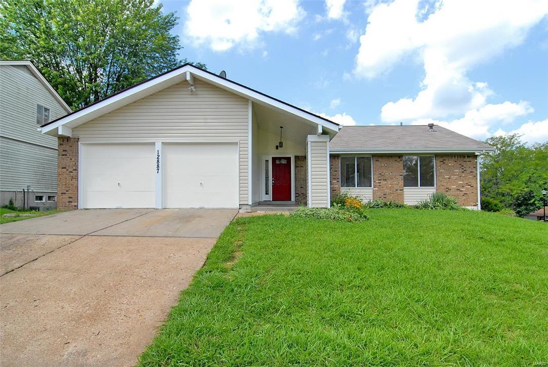 This gorgeous, open-concept style home has been gut rehabbed and is ready for your family! More than 1,250 square feet -- 3 bedrooms, 2 baths, 2 car attached garage and a walk-out, finished basement. Check out the kitchen on this one! Contemporary, custom cabinets. Beautiful neutral countertops and backsplash. You'll be the first to cook on the stainless steel matching appliances that stay with the house. Spa-like modern bathrooms have been renovated as well. Beautiful wood floors, open concept living room with decorative fireplace. NEW furnace and hot water heater. Fresh paint throughout - truly too many updates to list...plus a nice sized backyard!