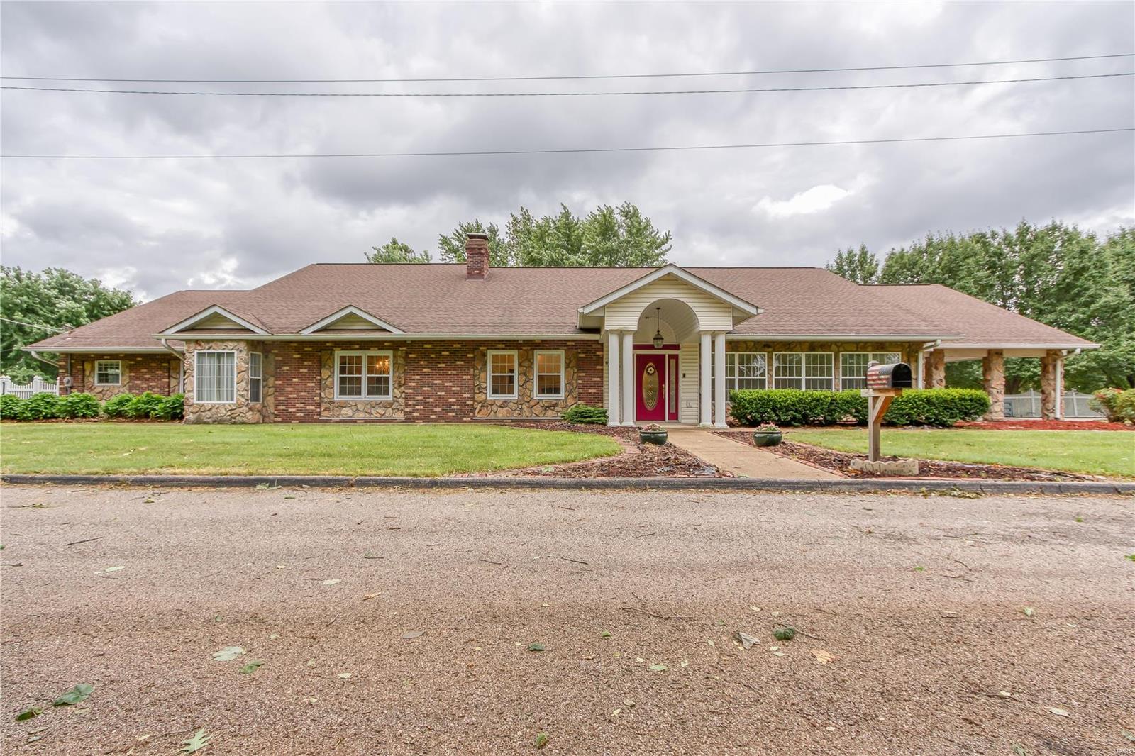 Opportunity abounds w/ this rock-solid, mostly brick & stone atrium ranch! Spacious 3 bedroom/3.5 bath on nearly 3 acres in Seckman schools. The oversized 3-car garage w/ storage room also includes a lighted 3-car portico & plenty of additional parking for your RV or utility vehicles! Large, level expansive lot is already subdivided to allow for an effortless new construction opportunity! The interior fashions hardwood & ceramic tile floors, big kitchen w/ plenty of counter & cabinet space, induction cooktop and large pantry, great room with double-sided fireplace into hearth room, crown molding and wet bar, sitting room, two master bedrooms and main floor laundry. Finished LL recreational space outfitted w/kitchen, laundry room, full bath and tons of natural light. Composite deck, storage shed, a flat/functional backyard and close proximity to Hwy’s M & 21 round out this masterpiece! So much to see! Listing includes lots 1,2,3,4,5 & 6 of Lambrich Acres. Additional Rooms: Sun Room