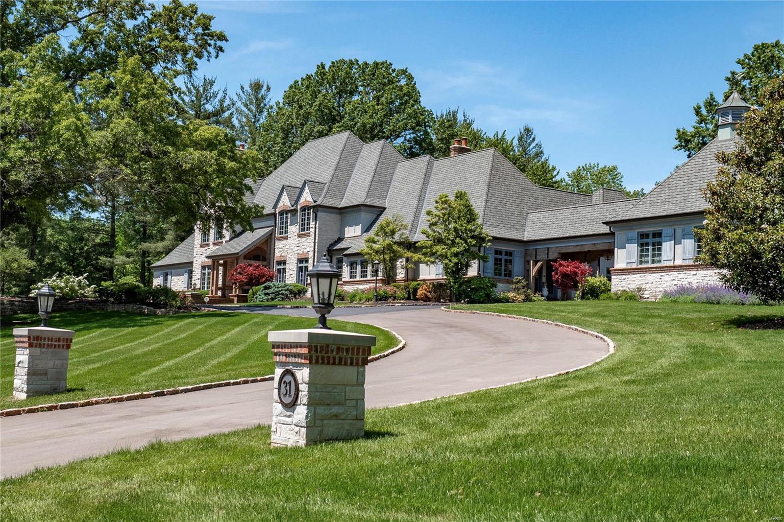 Nestled on over 3 acres in prestigious Somerset Downs is a private retreat with nearly 12,000 square feet of luxury living.  Designed by Mitchell Wall and built by Higgenbotham in 2001, the country French home offers impeccable craftsmanship, fine appointments, extensive millwork and twelve foot ceilings.   An impressive reception hall with a two-story dome ceiling is a warm welcome home and a blend of grand and intimate gathering spaces offer the perfect  backdrop for those who have memories to create.  New updates have been added to freshen the décor and allow for effortless living and entertaining.  Resort amenities include fitness, screening, billiards and wine rooms, a lower level kitchenette, pool house with kitchen, great room, bed & bath, a saltwater pool with spa and fountain and a 5-car garage.   The home’s U-shaped design envelops an expansive slate patio and pool, framing tranquil views of sprawling green-scape and mature trees…perfect seclusion! Additional Rooms: Wine Cellar