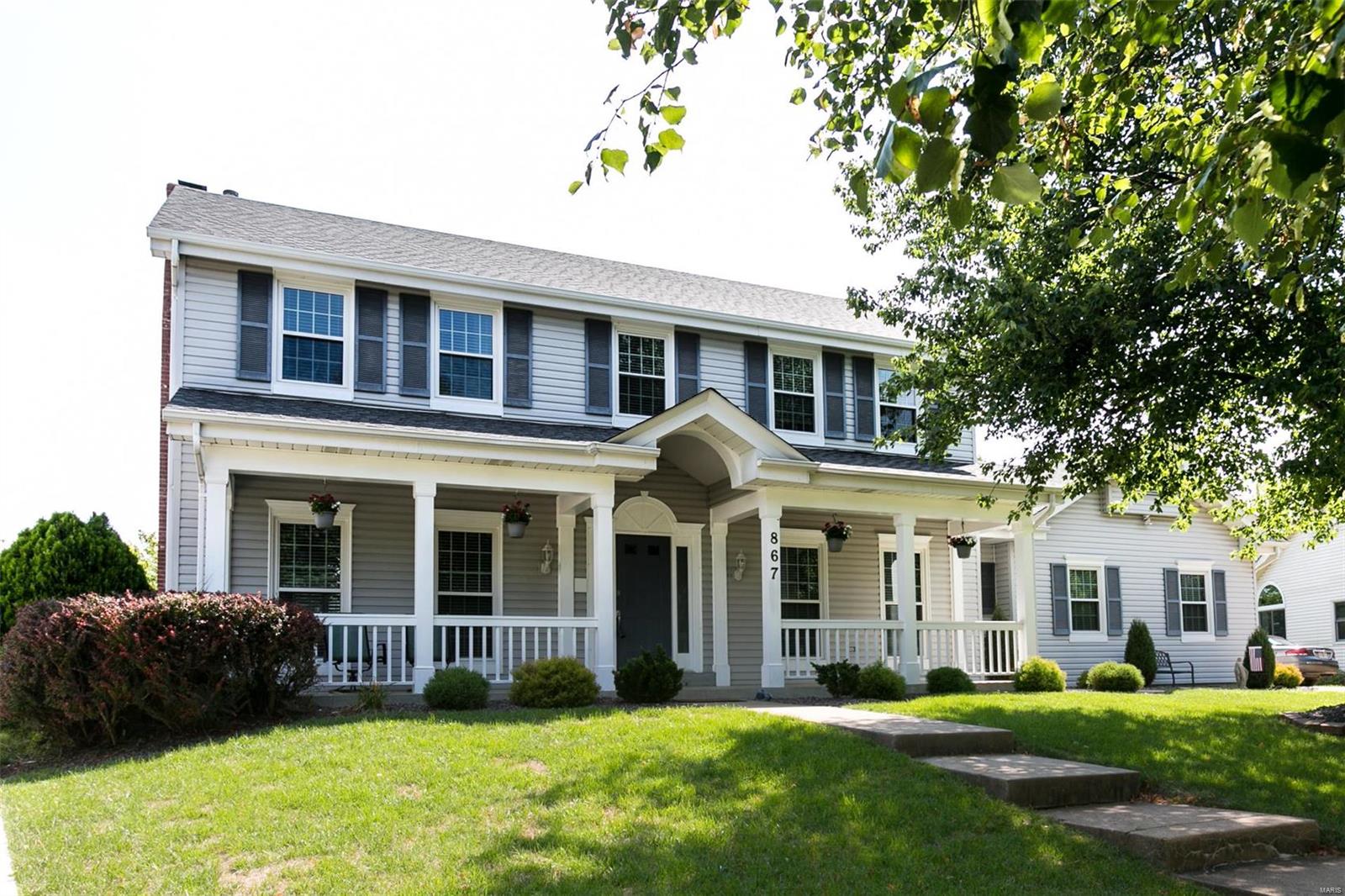 Exceptional quality in details throughout this beautifully restored spacious 4 bedroom 2.5 bath two story home, located in Westridge Manor Estates. Before entering this home, you will notice a wonderful full length porch next to an oversized 2 car side entry garage.       Inside, you will find a center hall plan including a 2 story entry foyer with  an open staircase with nice millwork. Additionally, there is a living room, dining room, family room with a wood burning fireplace, and a beautiful kitchen with new appliances, granite, and a bay window. Upstairs you will find renewed bathrooms and bedrooms, freshly painted, new lighting, some walk in closets, and new flooring. The lower level has 2 activity rooms, and lots of storage. Don't miss this immaculate home.