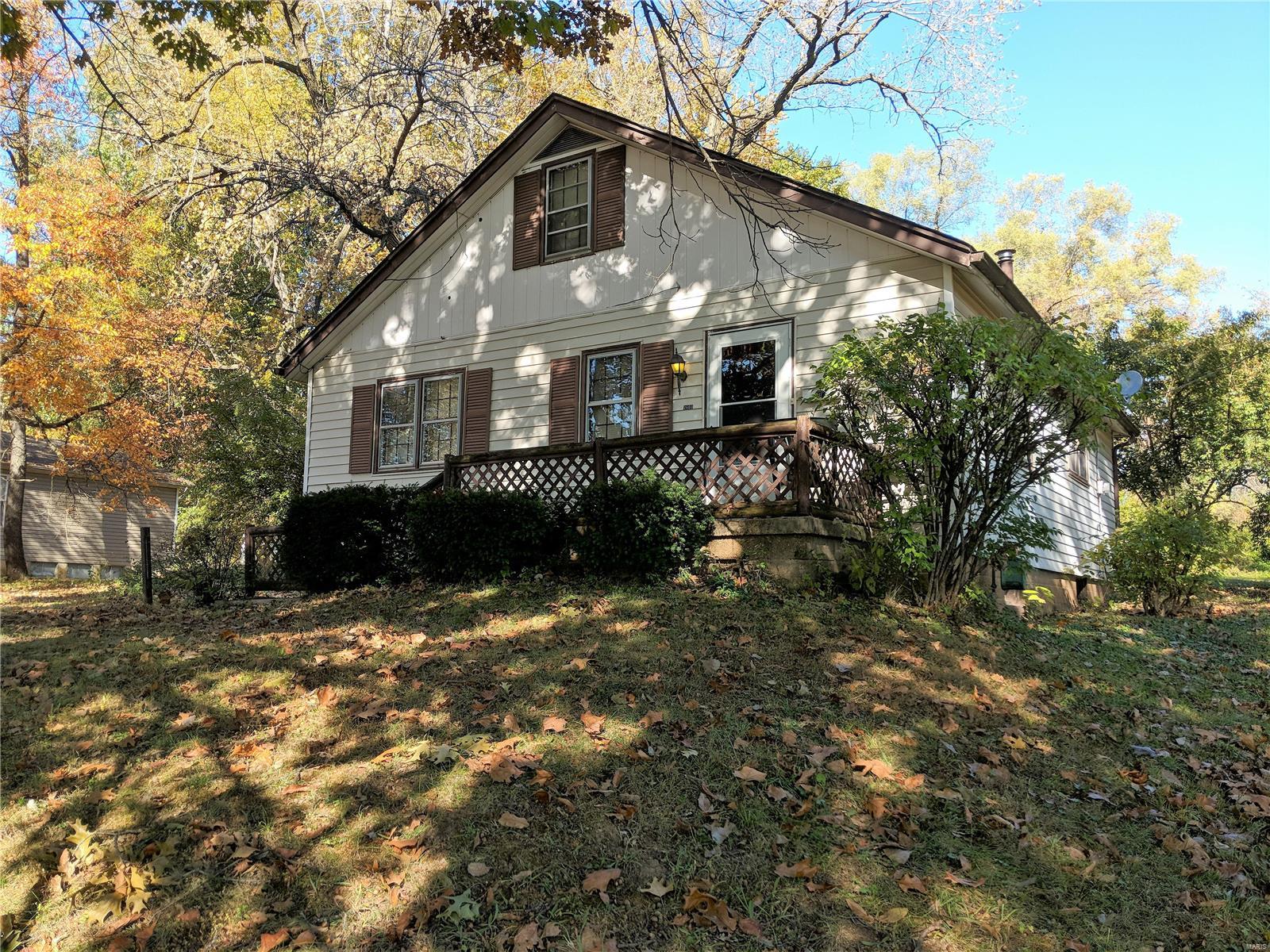 Bring your tools and ideas. Property is sold in AS-IS condition. Seller to do know inspections or repairs. Showings only with accepted contract. Please do not disturb the tenant. This 2+ bedroom home sits on over 1 acre mostly wooded lot. Living room, large country kitchen with pantry and some appliances. Big bathroom. Stairs lead to upper level bonus bedroom and sitting room. Full basement has lots of possibilities. Patio off the kitchen. Storage shed is the size of a one car garage.  Tenant is month to month and will move with notice, hopefully even before closing. ASK ME ABOUT RENOVATION FINANCING. See Supplement.