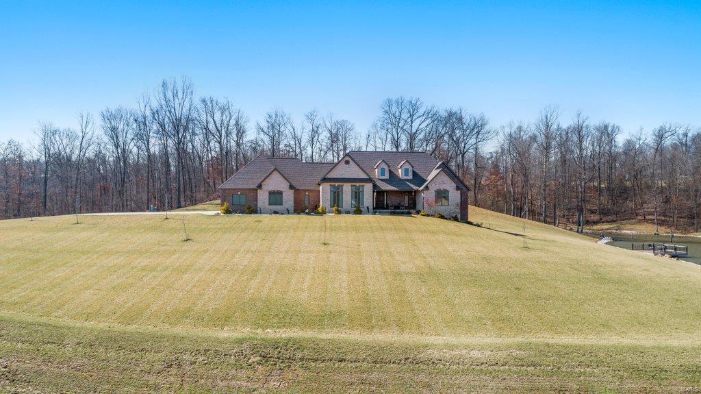 Meticulous attention to detail is apparent in this stylish, custom-built home. Located on 22 ac, you’re able to enjoy the stunning views from every direction. Upon entrance, you are greeted by dark hardwood floors, tall ceilings, fresh paint, open floor plan seamlessly connecting the kitchen to the living room, dining & leading to the back patio. The ml boasts 2 master suites w/ spacious bathrooms &  walk-in closets, laundry, ½ bath, mud room w/ additional storage & a 3-car garage. In the finished basement you’ll find 2 living spaces, office which can easily be converted into a bedroom, bath, bonus room, John Deere room & ample amounts of storage. Relax on the basement patio & enjoy the views of the pond which has a deck & is fully stocked w/ crappie & bass. This custom home also features a central vacuum system, ESI security cameras & lighting, spray foam insulation & irrigation system. Please visit https://youriguide.com/1331_co_rd_211_chaffee_mo/ for a 3D virtual tour of this home.