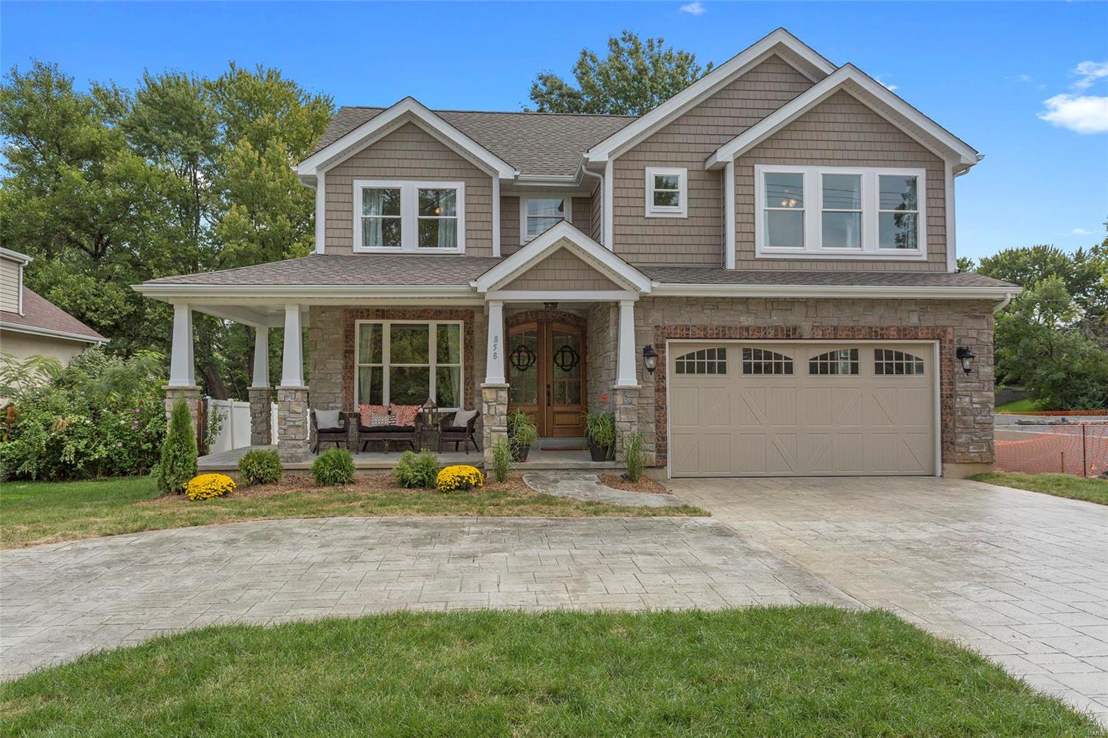 Executive Custom Built home w/open floor plan for today’s lifestyle! Stunning curb appeal w/wraparound porch, stone columns & stamped concrete circular driveway. Over 4300 finished sq ft of elegant & comfortable living space. Attention to detail throughout beginning with the solid mahogany entry door, wire brush finished hardwood flooring & wall of windows grace the rear of the home. Over 100 can lights, 3-piece crown molding, arched entryways, wrapped columns, wainscoting, & beamed ceilings; Great room w/ sleek linear fireplace. Gourmet kitchen w/ SS Viking appliances, under-cabinet lighting & quartz countertops w/ beveled tile backsplash, serving bar w/twin wine coolers; Large master suite w/dual walk-in closets, luxury bath; Three addl BRs, all w/walk-in closets & two full baths in UL; Finished LL offers large family room, dry bar & 5th BR w/private bath; Laundry areas on both the main floor & upper level. Stamped covered patio overlooks large level yard ideal for a pool. Additional Rooms: Mud Room