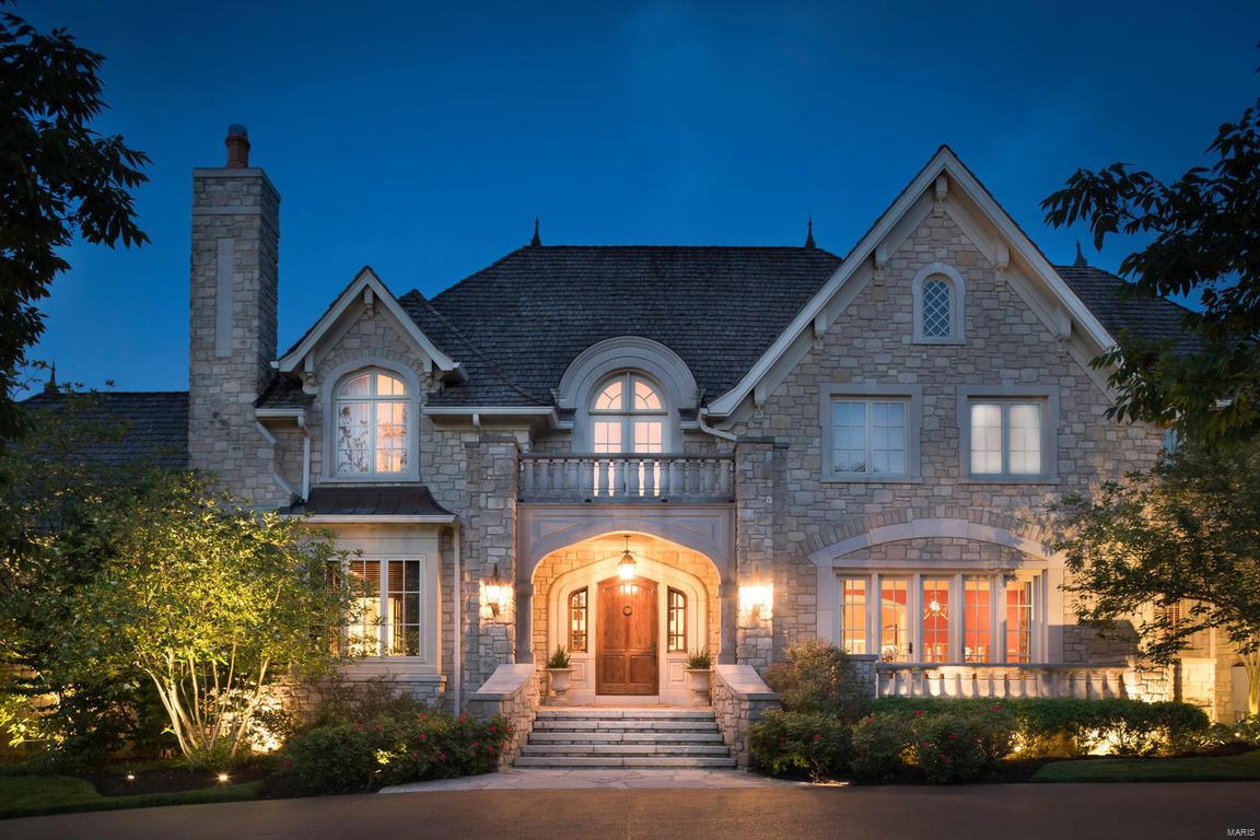 Welcome home to this charming and cozy estate waiting for you to make lifelong memories. This custom built masterpiece has been tastefully designed and meticulously maintained. The sprawling 3 acre lot backs to Old Warson Country Club. The 2 story living room w floor to ceiling windows is the dramatic focal point of the main level that draws you into spaces made for gatherings.The private master suite boasts a sitting area,opulent bath, handsome office and generous sized closets.It is truly an oasis. You will be amazed by the craftmanship, soaring ceilings and thoughtful finishes. The top of the line kitchen spills out to an awe inspiring covered patio/bar,laundry,bath and stunning pool.The trophy room, indoor golf studio, in-law quarters and 5 bay garage are what make this stunning home the gem of Ladue.