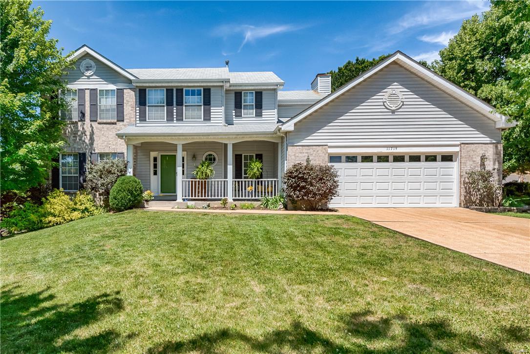 Great Sunset Hills home located in popular Twin Meadows and Lindbergh Schools!  Pulling up to the house you will be greeted by the charming curb appeal and covered front porch.  Inside finds a separate entrance foyer to greet guests; spacious open living room and separate dining room w/gorgeous new wood floors in 2014 and distinctive bay window in dining room; fantastic open kitchen/breakfast room/family room floor plan; kitchen and breakfast room w/ceramic tile floor, great counter/cabinet/pantry space, greenhouse window and sliding glass door to deck; family room w/bay window, fireplace and built-in bookcases; main floor half bath and laundry; master suite w/walk-in closet and en-suite bath; three additional bedrooms and hall bath; finished w/o lower level w/great space and full bath.  Outside offers great outdoor living with a deck, spacious concrete patio, large level private fenced backyard and firepit.  Other updates include HVAC 2014, hot water heater 2016 and roof 2007.