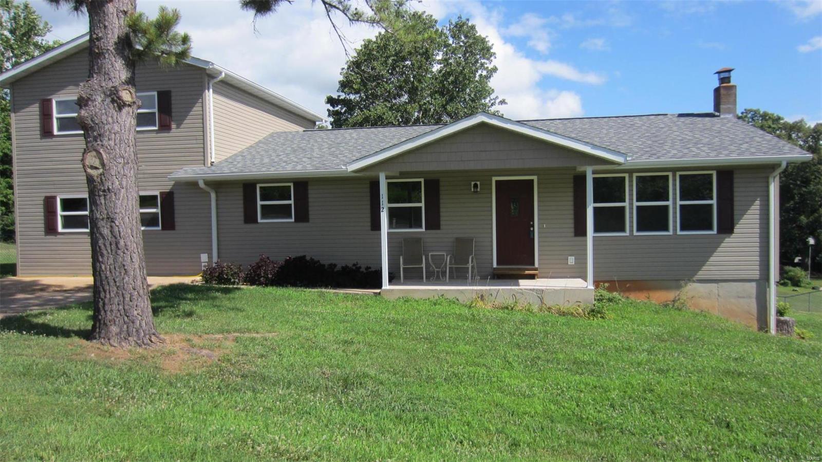 If you are looking for the perfect home for a large family, this is it! Conveniently located in a quiet neighborhood less than 5 minutes from the front gate of Fort Leonard Wood. COMPLETELY remodeled including roof, electrical, plumbing, siding, energy efficient windows and zoned HVAC. Feels like walking into a new home. Large bright living room, large eat in kitchen with stainless appliances and pantry, 5 spacious bedrooms, 3 full baths, 1st floor family room and laundry. Three bedrooms are on the main floor and 2 are upstairs. 1st floor Master suite includes double sink vanity and large walk-in closet. Upstairs bedrooms have study alcove and full bath. The total size of the home is 3472 sq. ft. which includes the 1200 sq. ft. walk out basement which awaits future planning . Off the back deck is a huge partially fenced yard perfect for wildlife sightings. This home is waiting for the perfect family. Square footage and room sizes are approximate.