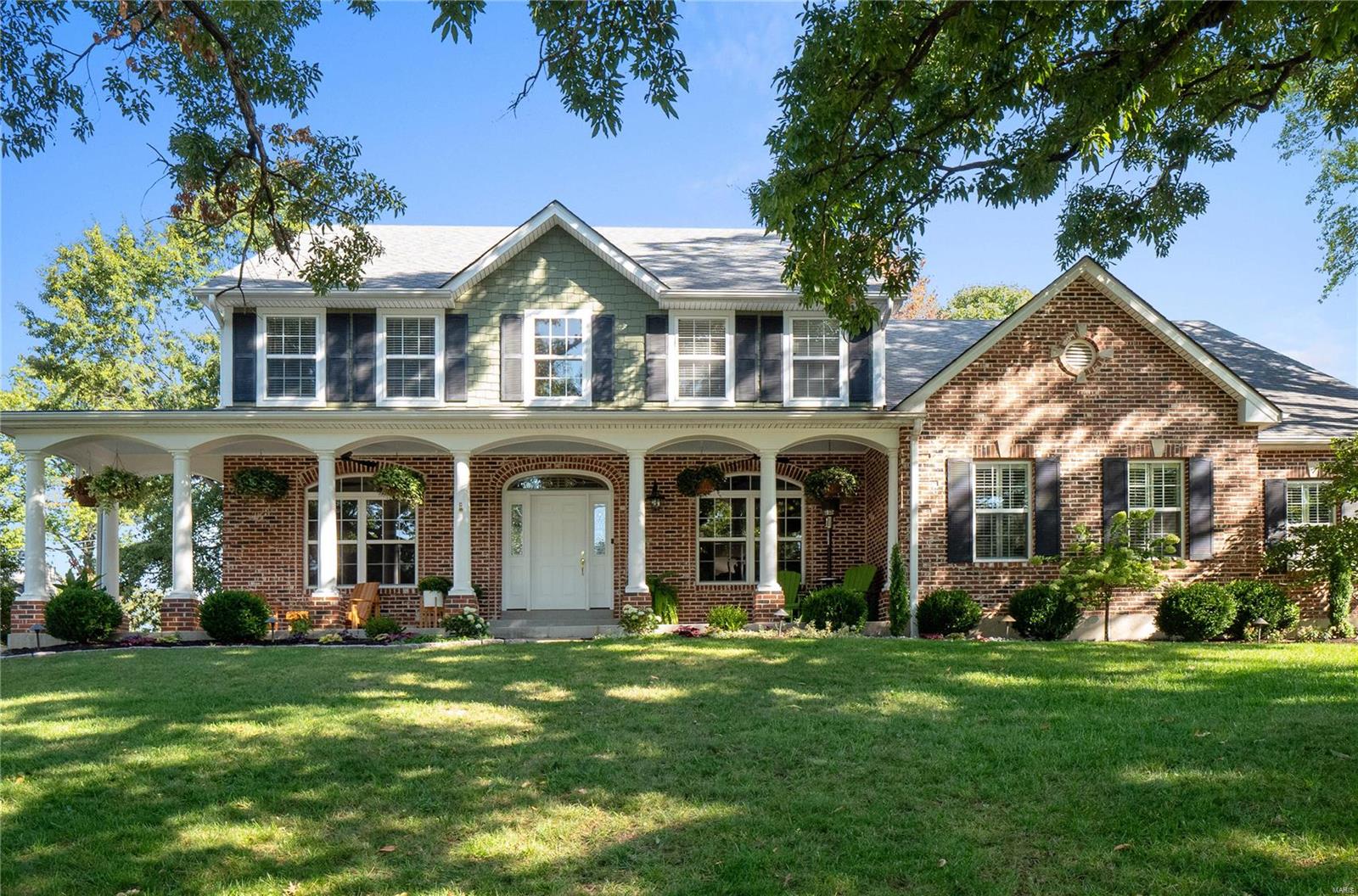 Better than NEW- Impressive Harwood Hills home w/ flawless Design & Impeccable Updates.  Picture Perfect exterior welcomes you w/ charming porch. Bright 2-story entry. Hardwood Flrs Thruout Home - Over 5,700 Sq Ft of Living! Expansive Great Rm w/ gas FP & custom built-ins w/ bench seat opens to Updated Gourmet kitchen. Lrg island, high-end appliances, tremendous counter & cabinet space & custom cabinetry opens to Hearth Rm.  Walk-out to pergola covered patio & custom outdoor grill island. Retreat to Spacious Main flr Primary Suite w/ walk-in closet & private lux. bth. Main flr laundry & built-in cubbies off 3-car garage. 2nd flr boasts 3 BR’s & 3 full Updated baths (2 ensuite, 1 hall) Plus Lrg Bonus Rm (4th bdrm upstairs). LL is an Entertainers Dream! New Custom bar w/ lrg island, fridge/freezer drawers/micro. Add. Fam Rm, full bath, workout rm & plenty of add. space for recreation. Meticulously maintained patio w/well manicured /private yard. Extensive Updates List in Supplements.