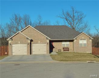 You will adore this beautiful home! Situated near the main gate at Fort Leonard Wood this amazing 6 bedroom 3 bath 2 car garage home has the space for the family and friends.  You will love the fenced in back yard for pets, and games with the family.  The main level has 3 bedrooms and an amazing master suite.  The master bath features a jetted tub, separate shower, double sinks and lots of space. The living and dining room have durable laminate floors.  The kitchen has all stainless steel appliances, with refrigerator, dishwasher, microwave, and flat top oven/stove all on tile flooring.  The center kitchen island is a great spot for homework or a quick meal, and provides more storage. The basement has a full bath with double sinks, and 3 more bedrooms.  The large recreation room is equipped with a wet bar and cabinets for all the supplies, and a living room. On the rear of the home is a amazing covered deck providing a front seat view of the Ozarks! Call today and start packing!