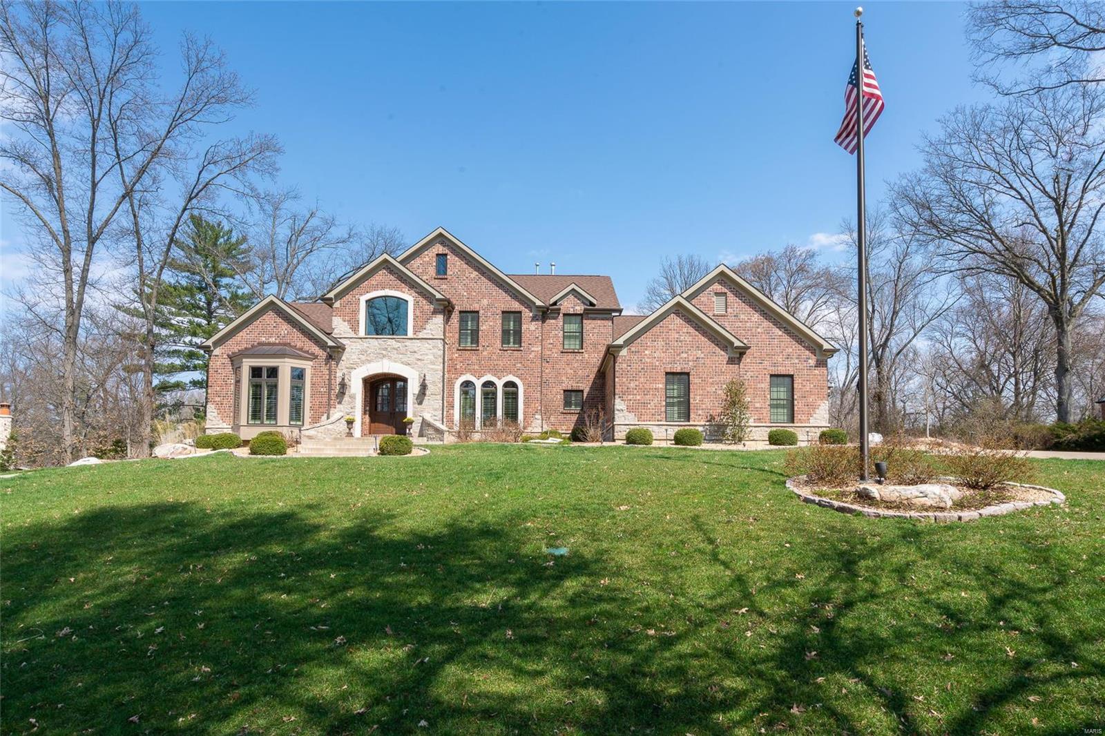 Striking 7 year new home offering over 6,000 sq ft of living space in the heart of Ladue on 3/4 acre lot.  Abundant architectural details found throughout.  From the 2-story formal entry foyer: formal dining room with Coffered ceiling, moldings & Palladian windows.  Private study off entry. Great room with fireplace, wall of windows & 9’ wet bar.  Kitchen built for the epicurean with custom glazed white cabinetry, stone counters, commercial grade appliances & center island.  Hearth room with vaulted ceiling w/ wooden beams and floor to ceiling stone fireplace.  Spacious 1st floor master bedroom retreat with over sized walk-in closet, double vanity,  soaking Jacuzzi and separate shower. Plantation shutters. Laundry room with built-in office.  Front and back stairs to 3 bedrooms – 1 en-suite, 2 Jack n’ Jill.  2nd floor secluded office/craft room.  Landscaped grounds, patio & fireplace & 3-car garage.  Deep lower level pour with roughed in plumbing. Additional Rooms: Mud Room