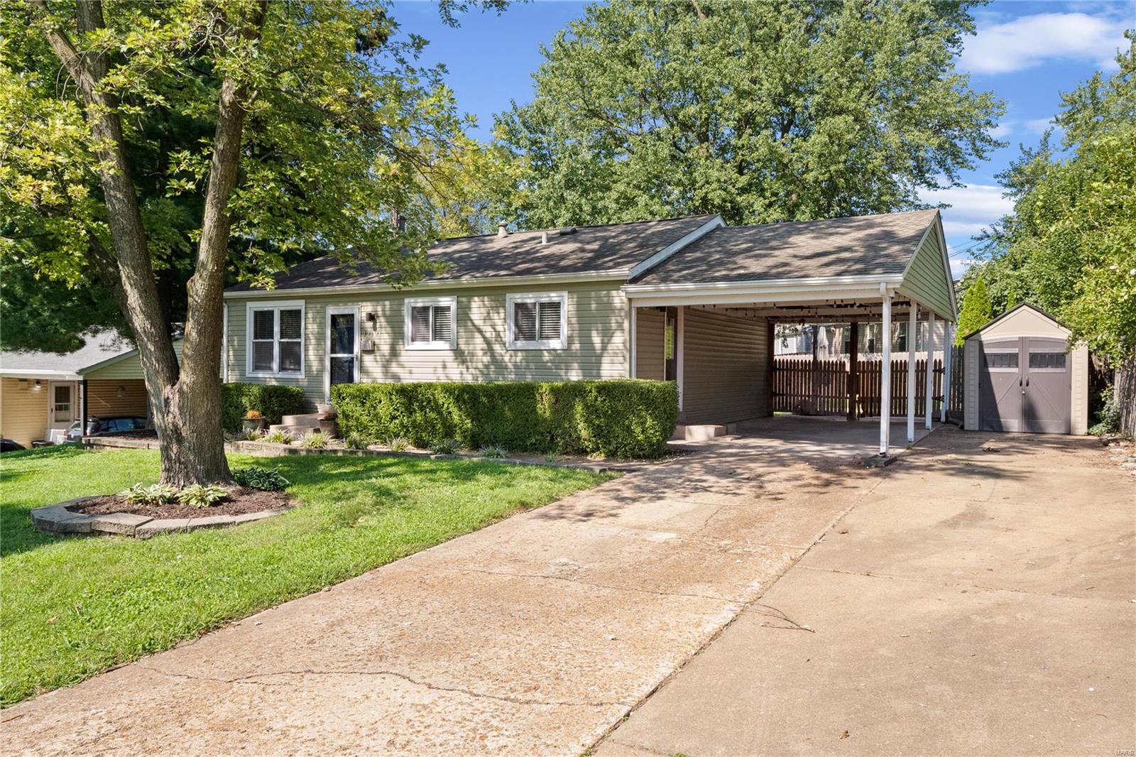 Welcome home to this adorable 3 bedroom, 2 bath ranch in the heart of Maryland Heights.  Beautiful wood floors flow throughout the living area, hallway and all three bedrooms.  The bright eat-in kitchen boasts lots of cabinetry and counterspace. The basement is partially finished with a full bath, laundry, rec room, family room and a nice-sized storage/utility area. The backyard is fully fenced and features a great patio for entertaining as well as the carport having decorative lights to add ambiance for your guests. The driveway is enlarged for double-width parking. The location of this home is amazing with easy access to major highways and shopping.  You've found the complete package with this home - it is sure to please!