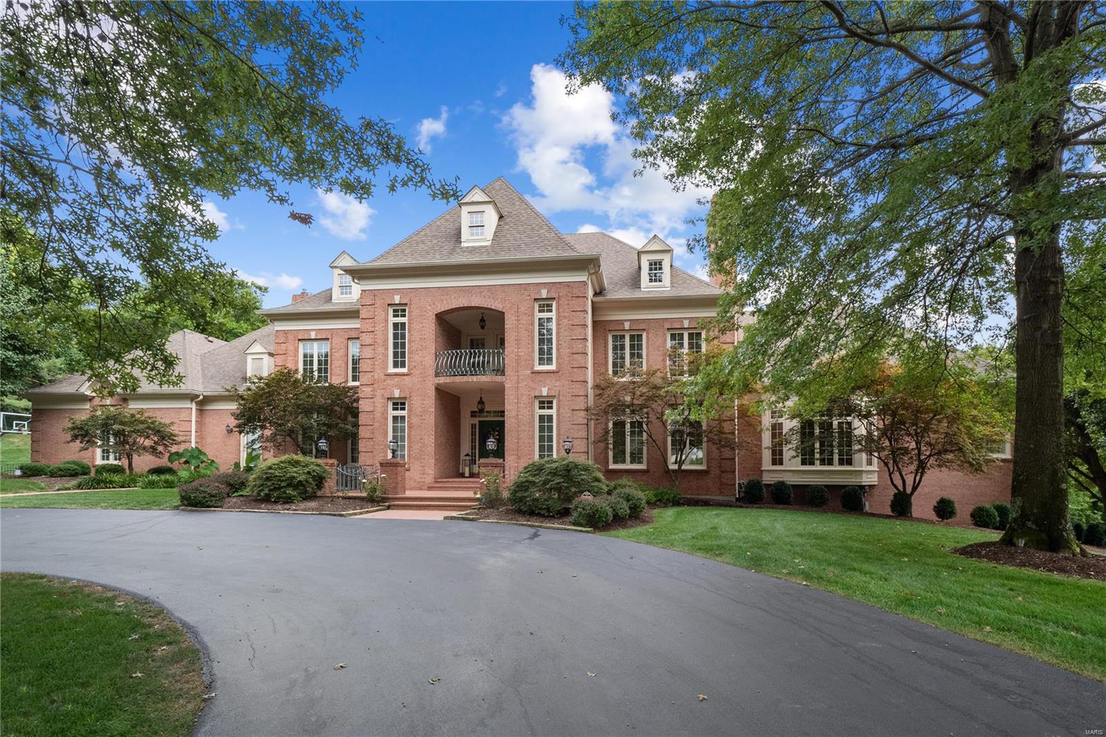 Remarkable estate offering 11,000 sqft of finished living space on a spectacular private lot. Beautiful, resort-like, outdoor area w/ an inground pool, hot tub & pool house w/ wood burning fireplace, TV area, outdoor kitchen, changing area, bathrm & storage. Enter to find the spacious formal dining rm & great rm boasting built-ins, fireplace, bay window & adjoins the family rm w/ a custom wet bar & fireplace. The fabulous gourmet kitchen features 2 center islands, top of the line appliances, 2 ovens, gas range, grill & griddle. Adjoining breakfast rm & hearth rm. A master wing w/ a large bedrm, private study w/ built-ins & a fireplace, private deck & updated lux bath. 4 addtl UL bedrms, 2 w/ studies & private balconies, & 3 full baths. Finished walk-out LL w/ nanny/in-law quarters w/ a bedrm & private bath, rec rm, game rm, exercise rm, billiard rm, sauna, massage rm & another full bath. This splendid home welcomes you w/ custom features & spectacular attention to detail at every turn!