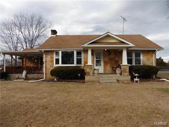 Must see 2 bedroom cobblestone home on 5+/- acres! Country setting, fenced yard, circle driveway. Updates include new windows and flooring. Large dining room with pantry. Bay window in living room. Alarm system. Electric heat pump HVAC. Large Super clean partial walk-out basement. Detached 1 car garage that could be 2 car with workshop area and extra storage with covered part in back. Great location close to Hwy 67 and town. Some woods and fields, lots of deer and turkey.
