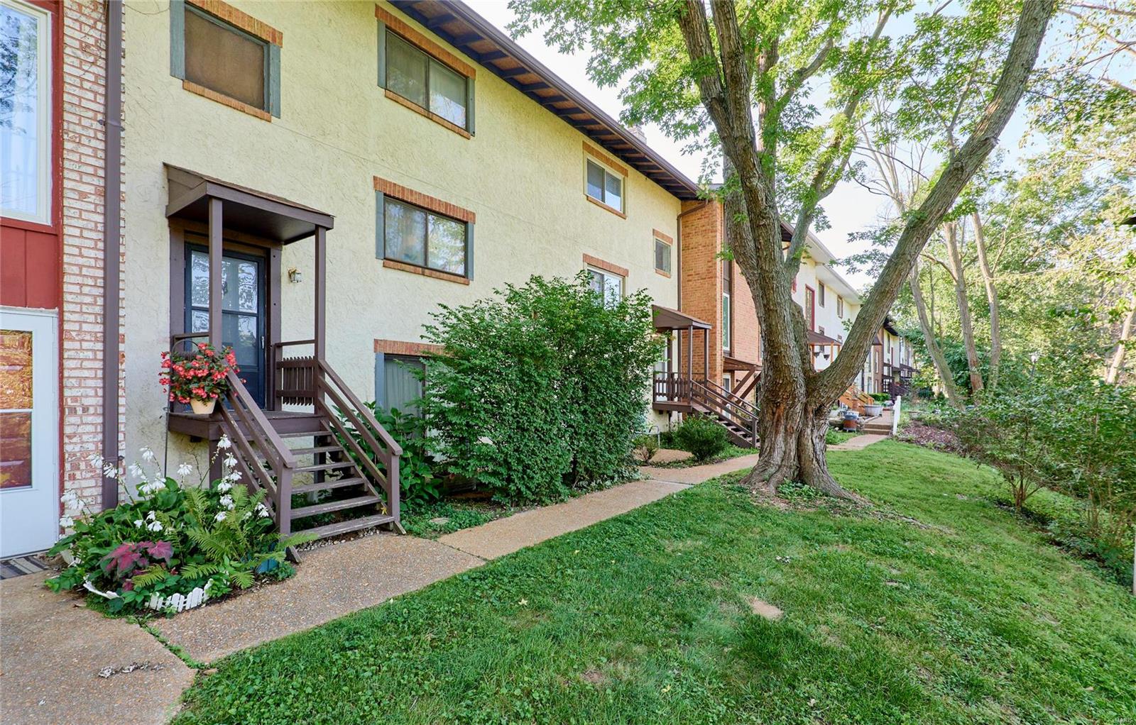 This fabulous townhome is located in the great Rockwood School District within walking distance to Bluebird Park, Ellisville Edge Aquatic Center and stores/restaurants. Renovated spacious 3 bed / 3.5 bath townhome situated on the corner of Manchester & Clarkson rd. There are over 1,750 sq ft of finished living area. Freshly painted with brand new floors on the top level, new carpet on the staircase, updated plumbing. Hardwood floor throughout most of the main level. The spacious kitchen has custom backsplash, beautiful breakfast bar & two walk-out entries to the large freshly painted rear deck. All appliances, including two fridges and washer/dryer, are in good condition and come with the unit. Lower level featuring custom built-in entertainment center and custom built-in white shelves in the foyer area, and an outdoor storage shed. 
Two assigned parking spaces conveniently located to the unit are included. $355 monthly HOA fee includes water/sewer/trash together with some insurance. Additional Rooms: Workshop/Hobby Area Location: Ground Level