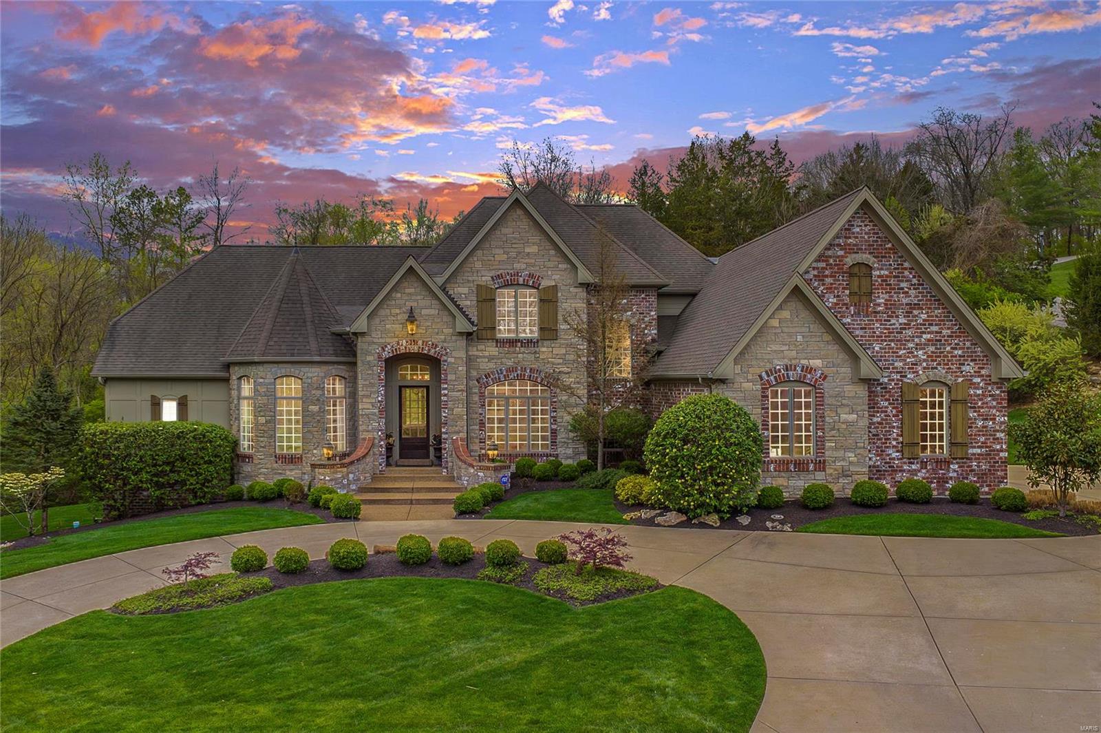 Exquisite, custom built 1.5 Story features over 6,400 sf living space (including covered patio with stone fireplace!) enhanced by exceptional craftsmanship & energy efficient systems throughout! Expansive hardwood Foyer opens to Study, gorgeous Dining Room & spectacular Great Room with 12’ ceiling, FP, built-ins, wet bar & wall of windows. State-of-the-art Kitchen with stacked cabinetry, granite, professional quality Thermador appliances & island/breakfast bar adjoins Breakfast Room & vaulted Hearth Room with floor-to-ceiling stone FP. Coffered Master Suite with 2 walk-in closets & beautifully appointed Bath with shower spa & massage tub offers a relaxing retreat. 3 add’l Bedroom Suites complete the living quarters. Walk-out LL with Rec Room, FP, 2nd Kitchen, Media Room & Guest Suite & 4-car attached garage. Relax on the covered patio, expansive pool deck, or take a dip in the in-ground, gunite pool, all while admiring the beautifully landscaped & private, wooded 2-acre lot!