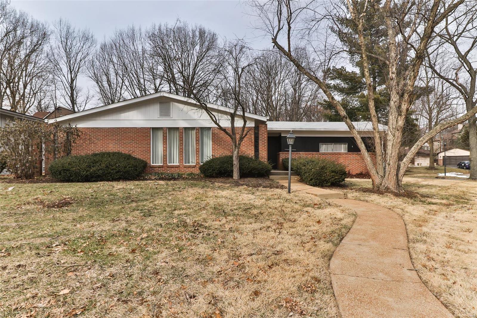 Teardown or time to redecorate? You decide, but either way you'll end up in a GREAT location in Ladue School District. Incredible potential! Impressive setting on the 1/3 acre lot. Living room-dining room combination is wonderful for entertaining and, like most rooms in the home, appears to have wood floors under the carpeting. Eat-in kitchen with its retro-now-stylish wallpaper will be where everyone wants to sit around and talk. It has a large pantry and lots of counter space. Central to the family room is a gas fireplace for those oh-so-cozy winter nights. 2 car garage off of this  room. 3 bedrooms and 2 baths complete the upstairs. Downstairs is partially finished with a recreation room, but the possibilities are endless, especially since there is already a half bath and it's a walkout. Add another bedroom, an office, or more hang-out space. Roof is only 1.5 years old; newer HVAC. If you want to tear it all down and start again, you've got plenty of company in this area. AS IS SALE
