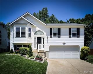 This fantastic house has over 1400 sqft of living space and great curb appeal. Lots of natural light, a vaulted ceiling  and the open floor plan makes this home very inviting. The main floor has a spacious great room with a bay window, kitchen and dining area, master suite and two other bedrooms.The lower level has been nicely finished with a family/rec room. The backyard is definitely a place you will spend alot of your time with a built-in gas grill, hot tub, huge deck, gorgeous landscaped pond with rock waterfall and flat fenced yard. There is also a workshop in the back of the yard that has heat and electric. The two car garage is over-sized and has ample space for two vehicles and extra storage. Seller is offering a one year Home Warranty Plan from HSA.