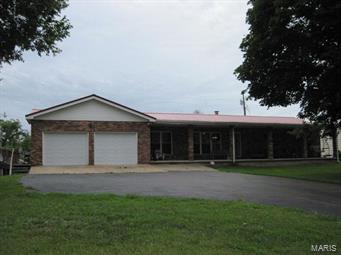 HUGE PRICE REDUCTION on a working cattle farm located in the heart of the Ozarks! 497 acres of lush green grass, large trees, several springs, 5 ponds, and three quarters of a mile on the Huzzah River! Main home has 3 bedrooms, 2 bath with beautiful kitchen cabinets, full basement, 2 car attached garage, and lots of living space. Second home is a charming rock home built in 1941 with 4 bedrooms, and 1 bath. Second home is currently rented, and would be perfect for a mother-in-law quarters! 70 acres of hay bottomland, with around 300 round bales being cut each year. 4 Stocked ponds with bass, redear, catfish, bluegill, and crappie! This property also features 4 wells, fenced and cross fenced, scale barn, cattle working facilities, chicken coop, and much more! This property is mostly open with scattered trees throughout, and backs up to the Mark Twain National Forest with excellent hunting! This family farm has been in the family since 1887, and owner has run up to 200 head of cattle!