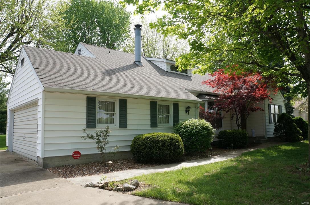 UNIQUE!  This is truly a 1950's farm house with all the modern conveniences you would expect in the middle of town.  One owner home was part of a family farm that later became subdivisions.  Large living room features wood burning fireplace and 4-window bay.  Dining room also has a 4-window bay.  Beautiful hardwood floors throughout much of first floor.  Kitchen has granite tops, ceramic tile floor, 2 pantries and broom closet, new dishwasher, and smooth top range.  Pella windows.   Home sits on over 3/4 acre lot with a 36'x36' steel out building.  Nothing like it in town.