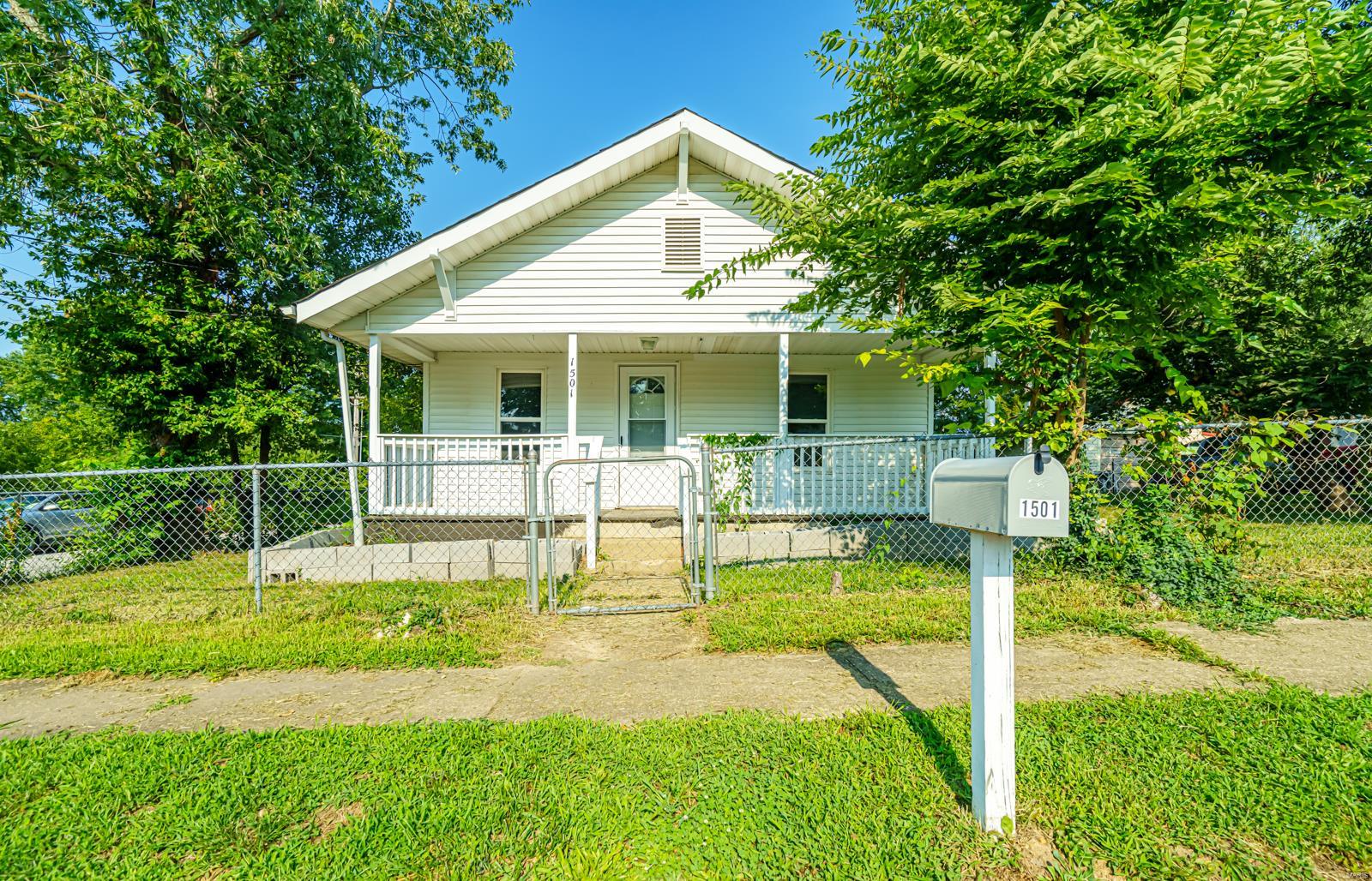 Adorable 2-bedroom,1-bath home in Rolla MO, offering 750 sqft of thoughtfully designed living space! Enjoy your mornings on the covered front porch or have a barbecue in the spacious, fenced-in backyard.The kitchen and living room feature elegant hardwood floors while recent updates include a new roof, and heating and cooling systems from 2022. The detached garage provides extra space for your car or a workshop. Nestled on a 0.220-acre lot, this home is ready to be your retreat. Schedule your viewing today!