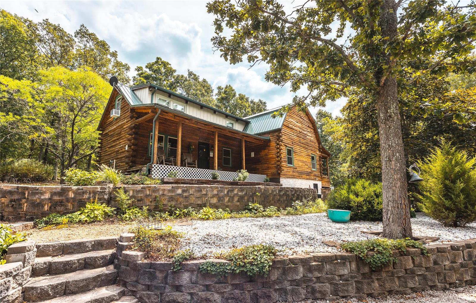 Custom built, 3888 sq ft Log Home. 1 1/2 story, w/ fully finished remodeled basement. Home has 5 bedrooms, 3 bath, 2 family rooms, 2 kitchens. Central air, propane heat, outdoor wood burning furnace. A new detached car garage with bonus shop area, built in 2021. 2nd home (796 sq ft) is perfect for a guest house. The home offers the open concept and built just 6 years ago by the Mennonites. Wall air, heat unit, 2 car carport, new storage shed, handicap accessible, chain link backyard. Event building (4808 sq ft) party deck, commercial large kitchen, restrooms, bride & groom rooms, screen & projector system, beautiful lighting, sound system. Décor and catering room, 9 tons of air, heat. The ceremony barn (1650 sq ft) is located in a beautiful field setting. Seats 150 guests, chandeliers & lighting. 40 acres of open land, woods, and 3 ponds. A barn in the field, gazebo, photo areas, large fire pit. 1952 international truck stays! Highway frontage location! FFE inventory included in sale.