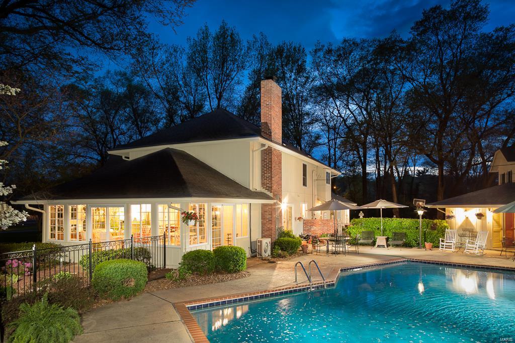 Arrive into a park-like setting on two acres. Soaring two-story entry hall, guides you to the light-filled living room filled with walls of windows and a fireplace. Sliding glass doors lead to a large deck that overlooks the front lawn. There is a formal dining room between the living room and kitchen/hearth room. Remodeled kitchen with a 6 burner Dacor cooktop, Sub-Zero refrigerator, Bosch dishwasher and double ovens. Granite counters and cabinets made by McMillan cabinetmakers. Adjoining is a hearth room with great seating around the fireplace. From the hearth room you can enter into a heated green house. Sun room is heated and cooled for use all year, with windows on three sides and leads to pool/pool house. Master bedroom suite is on the first floor, with his and her custom fitted closets.  The second floor loft is filled with bookcases and with a balcony off the front. There is a second master suite with bath, and 3 additional bedrooms and one full bath. Additional Rooms: Mud Room