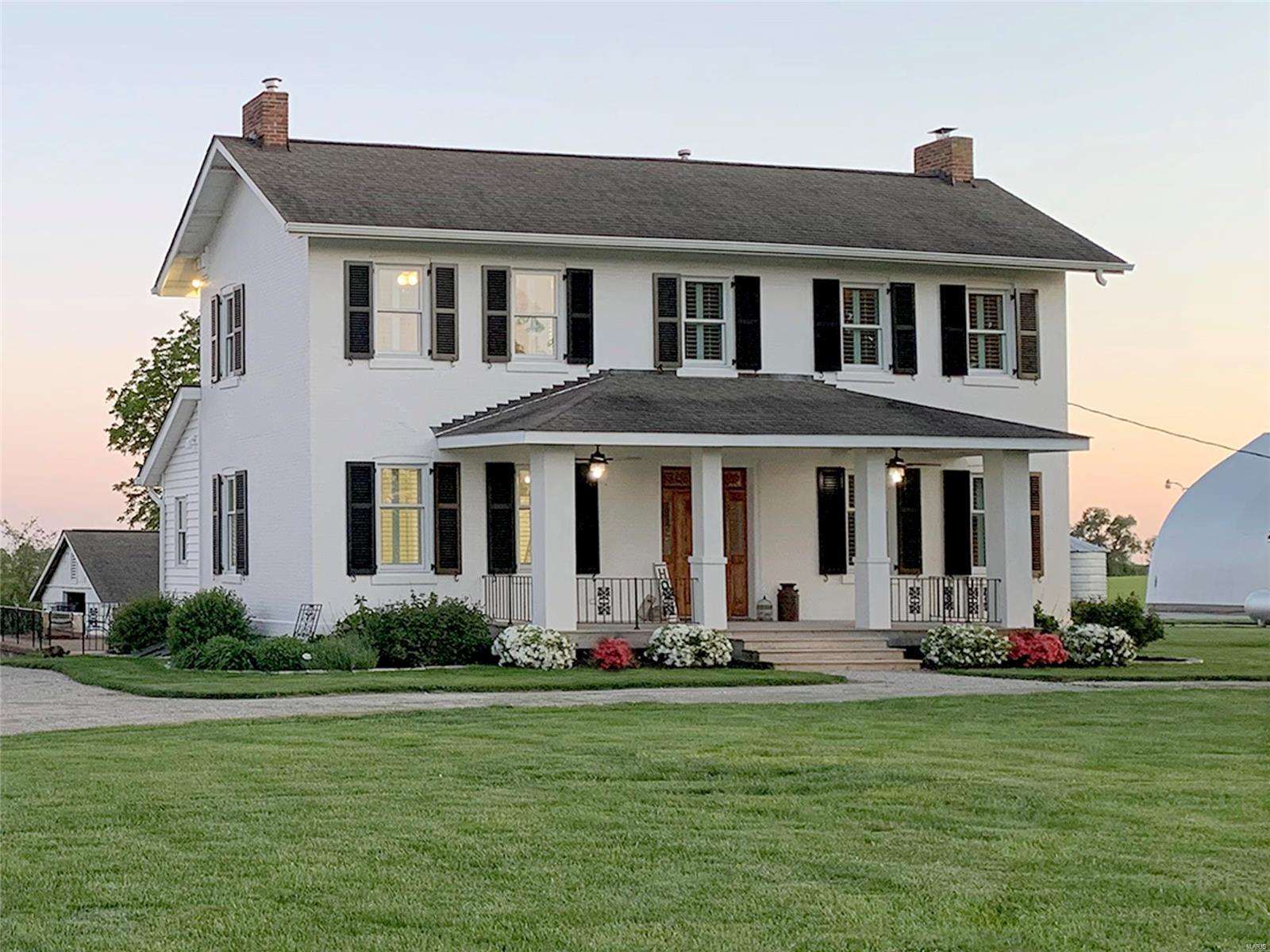This place will leave you speechless! Own a piece of history; Eli Keen home -Circa 1800s farmhouse! Restored w/exceptional craftsmanship, this local landmark boasts bells & whistles & offers safety & freedom of unrestricted country life. JUST 7min fr Hwy 370 & 20min to Lambert! Vintage character w/Brick INSIDE & Out, Hand-Milled walnut hardwood Floors, 10' Tin Ceilings, Shaker Style accents, Plantation Shutters. Chef’s Kitchen w/ hand-crafted Cabinets & Granite, Stainless Steel Appliances, copper sinks. Luxury Main Floor Master Suite includes resort-style spa bath, barn wood vanity & sprawling closet. Main Floor Laundry. NEW: wood windows, Hi-E HVAC, water heater. Zoned HVAC, hi-spd DSL, Cable. 3-acres w/ Heated 60x40 shop, barn, outbuildings, HUGE Garage. Boat, tractor, RV, or ATV storage. Seconds fr Grafton Ferry, Marinas, yacht & duck clubs, fishing. Boaters, bicyclers, hunters paradise! Goats? Cows? Chickens? YES! Amazing black soil gardening! Crystal clear well. FB@2148 Highway V.