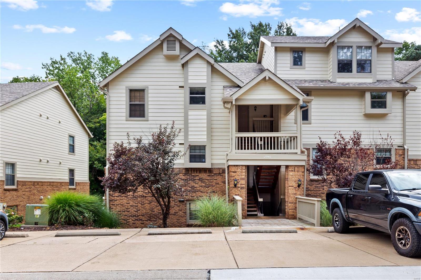 Welcome home to this ground level condo in central Maryland Heights within walking distance to Creve Coeur Lake! Upon entering, you are greeted with an open concept floor plan with a spacious living room, with updated laminate flooring, featuring a beautiful corner brick fireplace and mantel. Kitchen includes stainless steel appliances. Off the living room is a private deck w/ storage closet, that looks out to the wooded common ground. Two spacious bedrooms, 2 full bath, and laundry room with newer washer/dryer finish out this stunning unit. Additional features include a private assigned carport and HOA that includes a pool and clubhouse. Location: Ground Level