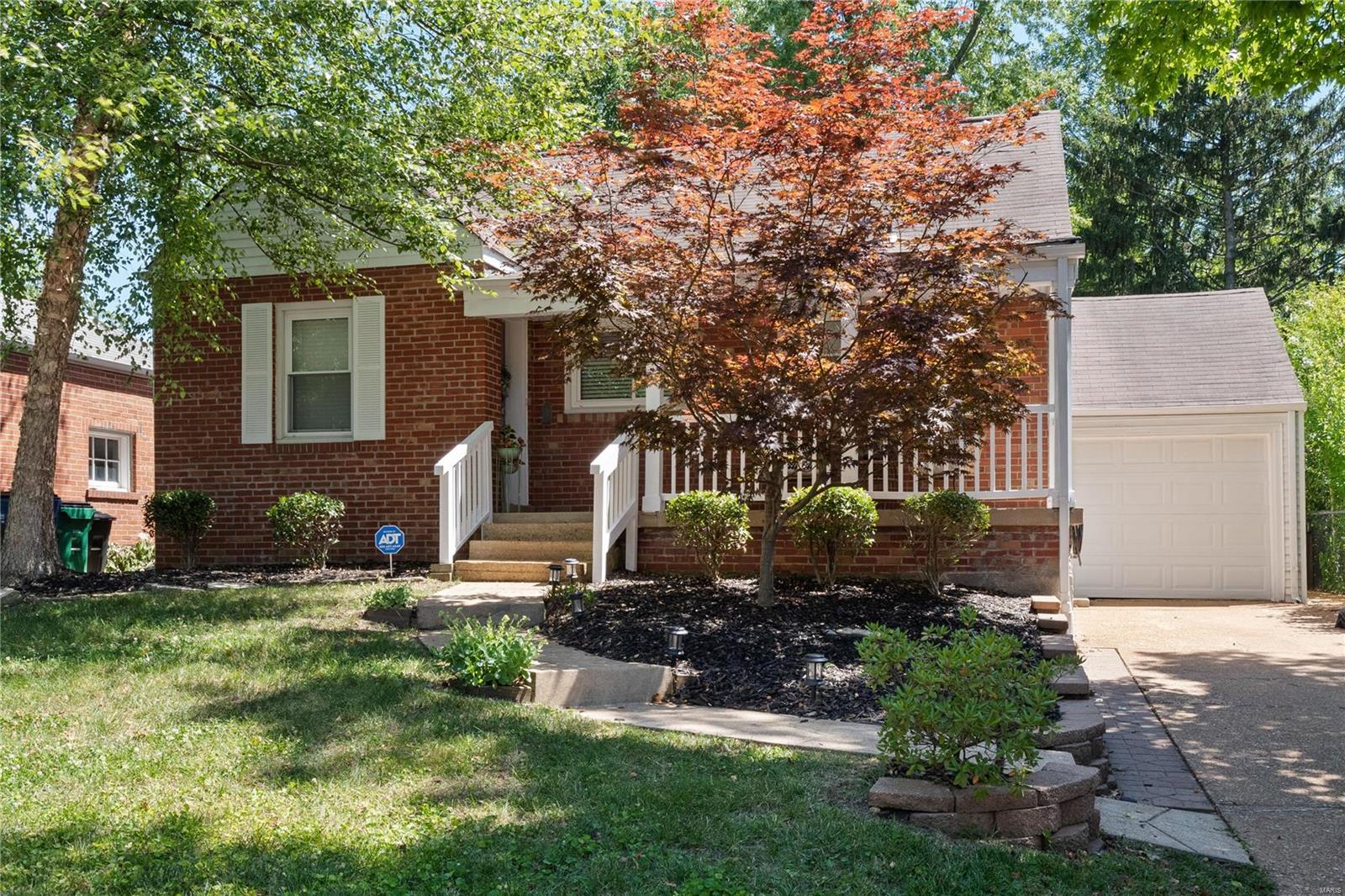 Beautifully renovated 3 BDRM, 1 BTH home w/1400+ sq ft nestled in a quiet neighborhood in the heart of Webster Groves district. Full brick exterior feat large and level, fenced in yard w/spacious bistro-lit back patio, oversized sitting porch, new side entry door (18), new back garage door (22) & lush updated landscaping. Walk inside to find open floor plan w/ wood floors throughout main area! Living rm leads to eat in kitchen w/custom 42" cabinets, stone counters, custom breakfast bar, new light fixtures (20) and NEW stainless steel appliances including gas range (21). Also on main you'll find 2 spacious bedrooms, sleek updated bathroom. The second-level includes a large private bedroom perfect for a master suite, den or playroom. Partially finished lower level includes poss 4th bdrm or office & family rm. The laundry area has section of custom built shelving, workshop, extra storage and laundry chute! PERFECT LOCATION with a short walk to parks & downtown Webster! Priced to sell!