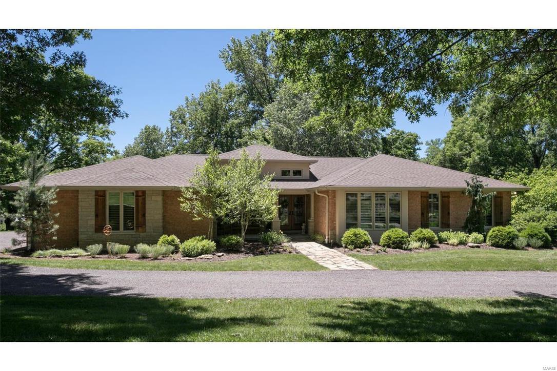 Discover a private oasis nestled on 2-acre impressive park-like setting in Town & Country. Spectacular high-end renovation (complete top to bottom) by visionary owner & brilliant architect lets you leave the rush behind in laid-back rustic luxury. From its dramatic cathedral style tongue/groove ceiling & two-story natural stone fireplace in the great room, to the well-equipped gourmet kitchen w/custom ash cabinetry & huge center island perfect for congregating, you’ll be sold before you even see the rest of the house. Gracious master suite w/sitting room & 3 beds on the main. Finished walk-out includes FR, 2 more beds, an office & full bath. And while the interiors certainly beckon you to put your feet up, you can’t possibly ignore the property. Revel in the natural and lush surroundings created by an extremely talented landscaper, dine alfresco on the huge deck or gather around the outdoor patio and fire pit and gaze into the open sky. See complete list of amenities attached. COOL: 14 SEER+
