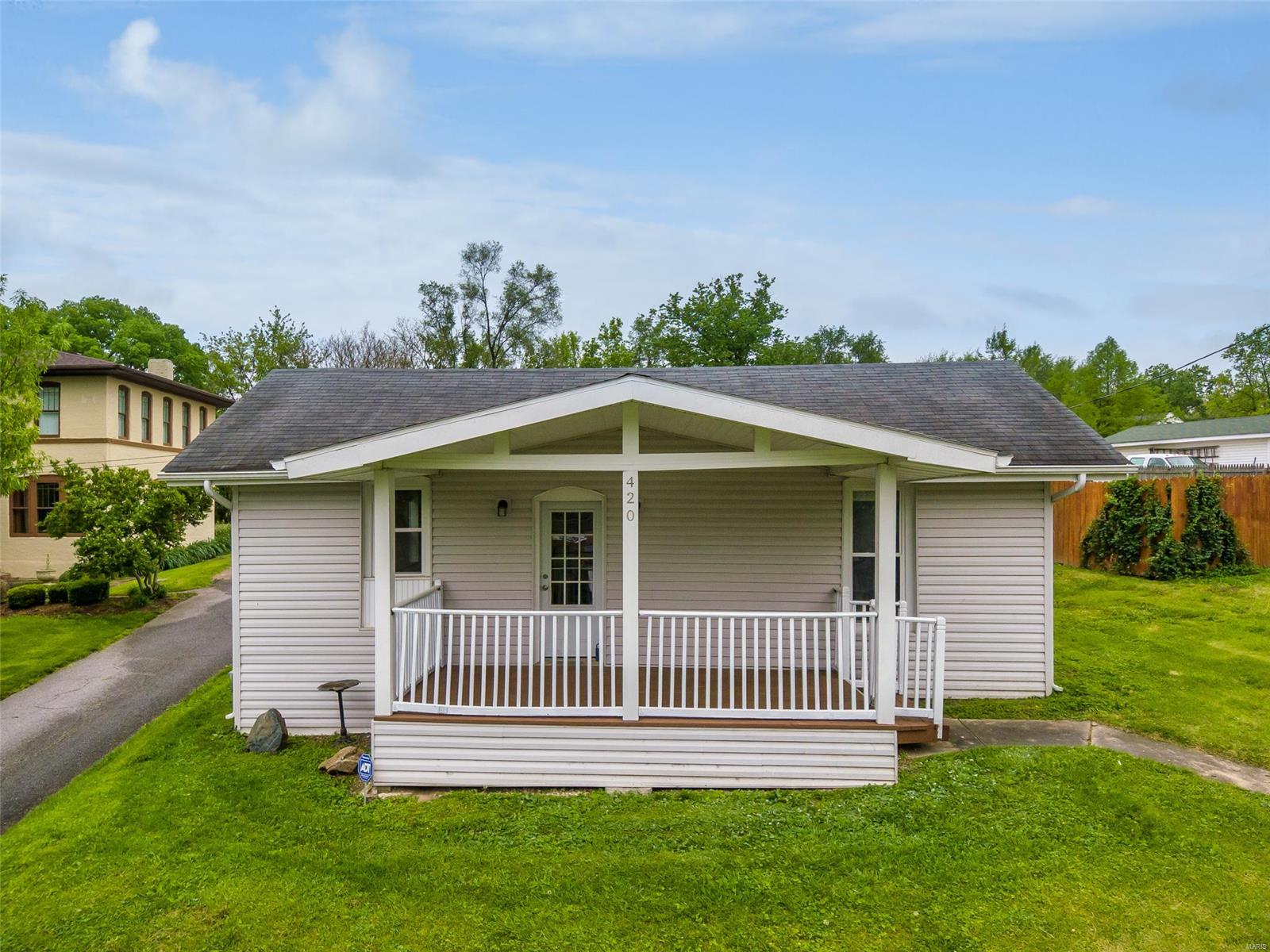 Charming 3 bedroom and 2 bathroom home in the heart of Troy is walking distance from the City Pool and 2 City Parks! This quaint cottage looks small from the outside but has 1800 square feet of living space.  Large bright kitchen with a large center island, white cabinets, neutral paint, and new Vinyl Plank Flooring. The huge great room has sliding glass doors to access rear covered deck, parking, and a detached over-sized 2 car garage. The master bedroom is very spacious with a walk in closet and master bath. There is a roman tub and stand up shower in the master bath. Both bathrooms have tiled showers for easy maintenance. This home is freshly painted and carpets shampooed through out. Schedule your showing today as this one will be gone quickly!