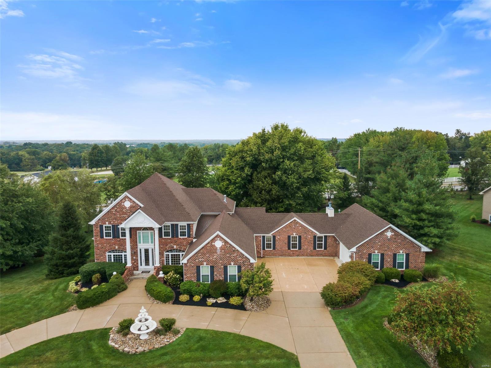 Welcome home to 7,000+ sq ft of finished living space on an 1+ acre lot w/ garage for 5+! But 5328 Enchanted isn’t just quantity, it is also quality. The main floor features an impressive 2 story great room w/ gas fireplace, master suite w/ bay window, double walk-in closets, jacuzzi tub, & separate shower, as well a front study, large dining room, & chef’s kitchen w/ quartz countertops, travertine, induction stove, & 2 walk-in pantries.  Also on this level is the laundry room w/ custom cabinets, 2 powder rooms, & a secluded stately office w/ wood burning fireplace. The 2nd level features 3 spacious bedrooms, each w/ a FULL bath, & a bonus room.  The impressive walkout lower level features a family room w/ gas fireplace, wet bar w/ fridge, dishwasher, wine fridge, & half bath, sleeping area w/ attached full bath, & a one of a kind theater room w/ 9 recliners, Dolby Atmos surround sound, & a candy bar. Located near top rated Francis Howell schools & mins away from Chesterfield Valley.