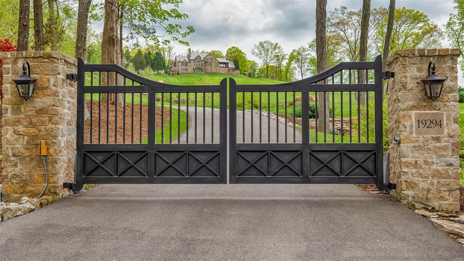 This is a rare opportunity to purchase a 77 acre estate in the Wild Horse Creek Valley. From the moment you enter the stone gates, you can see the stately home perched on the hill high above with commanding views. As you drive up you pass a lake with 2 waterfalls and a 10-bay barn constructed of cedar & pine in 2016. The home was built by Gene Roentz & designed by Lauren Strutman. Over 7,400 sq ft of living space with reclaimed beamed vaulted ceilings, 3 stone fireplaces & walnut flooring. The outdoor area includes a covered porch with outdoor fireplace & remote control screens. Saltwater pool & spa. The lower level is a walk-out with a recreation room with wet bar, billiards room & media room. 3-car garage in the main house. The carriage house has a large workshop, half bath & 2 garage spaces with 6 bays. This space is designed with the option to be finished as a guest house. Gorgeous landscaping & perennial gardens throughout the property with 2 lakes. 15 min to Chesterfield Valley. Additional Rooms: Mud Room