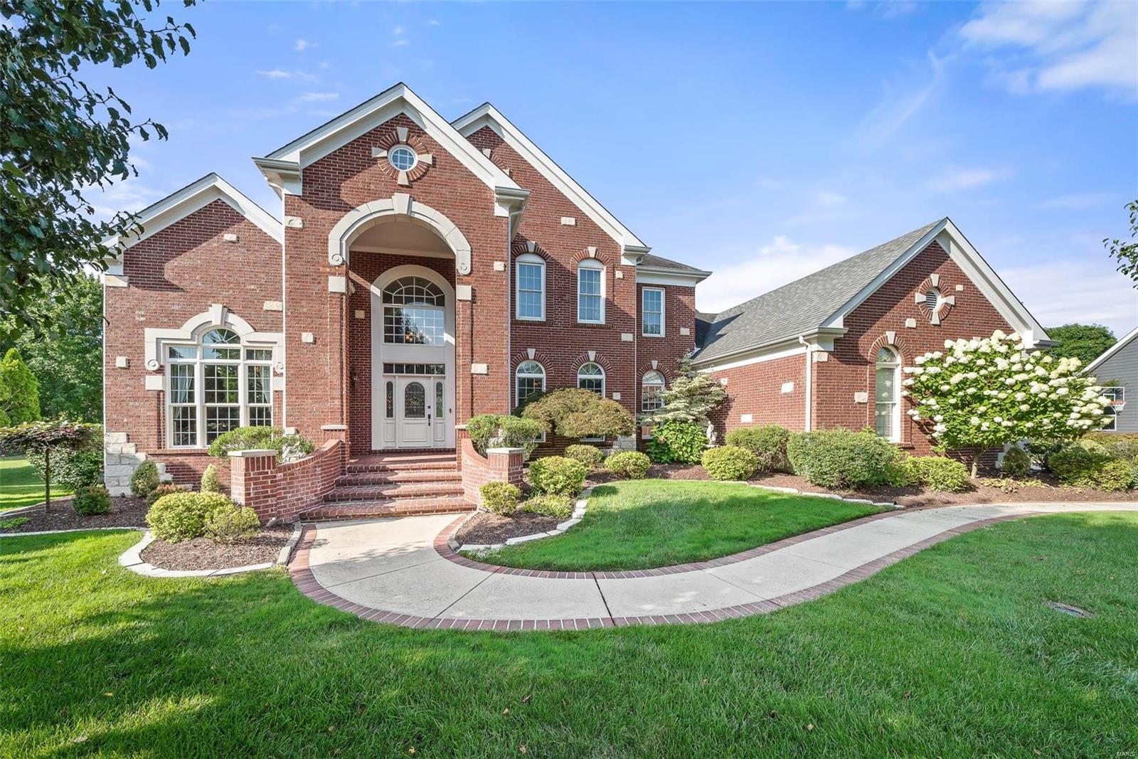 Stunning Miceli custom built home in the award-winning Rockwood School District. Second largest home in the subdivision, this 4 bedroom, 5.5 bathroom beauty overlooks a tranquil 2 acre lake and 5 acres of common ground. Step inside to admire the tigerwood floors, large living areas, and main floor master bedroom with an oversized ensuite bathroom. The chef’s kitchen was updated in 2018 and is complete with Viking appliances, black walnut center island, European Hickory flooring, and many more modern conveniences to entertain guests for years to come. The upper level offers 3 spacious bedrooms- all ensuite. The lower level showcases a recreational area complete with wet bar, bonus room for a home gym or media room, a walk out to a covered porch overlooking the picturesque backyard and gazebo. Other special features include new HVAC in 2018/20, 30-year roof installed in 2010, large Brazilian hardwood deck with built in stone fireplace, and oversized 3 car garage. This home won't last!