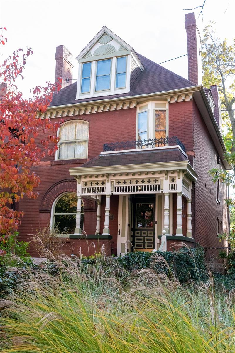This beautiful Compton Heights home abounds with historic charm and pride of ownership! Outside, notice the lovely landscaping and freshly painted trim. Enter into the foyer and notice the beautiful fireplace, grand staircase, and round radiator! The living and dining rooms retain their historical integrity with original unpainted millwork, pocket doors, fireplaces, and minibar pantry. You'll find the half bath beyond the dining room. Walk back to the fully remodeled, well-appointed kitchen. On way up to the second floor, notice the lincrusta along the wall. On the second floor, you'll find three bedrooms, along with a library, balcony, sun room, and the newly renovated full bath. The third floor showcases two large bedrooms, another full bath, and a small room that houses the HVAC for the second and third floors. The basement features a family room and ample space for projects. Nice patio out back with oversized 1 car garage. This home has everything! Come and see today!
