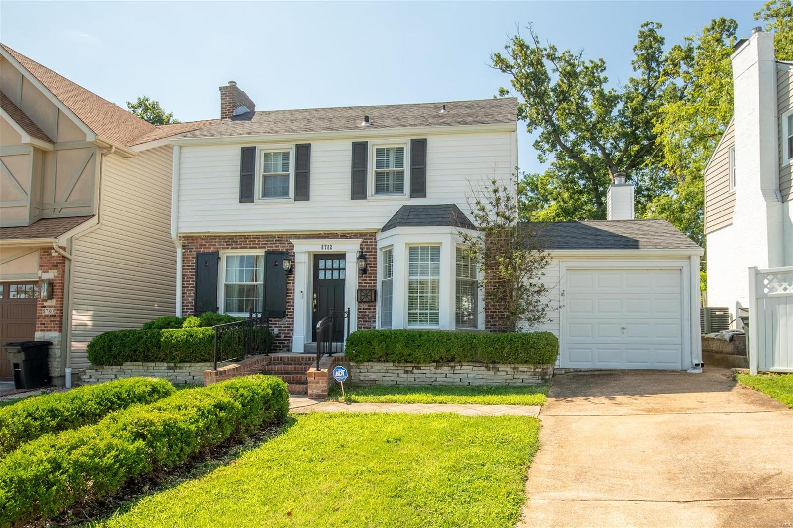 Charm abounds in this distinct residence with classic architecture & tasteful updates situated facing a beautiful tree lined street. Enter the foyer, open to the welcoming sunlit living room w/ a fireplace & beautiful hardwood floors. The updated kitchen has custom cabinetry, marble countertops, a subway tile backsplash & stainless steel appliances. Off the kitchen is a spacious family room w/ the 2nd fireplace and additional space that would be perfect for a home office. Upstairs has 3 bedrooms and a full bath.  Enjoy the lazy days of summer on the patio overlooking the tiered backyard. The house is full of architectural details including built-in bookcases, plantation shutters, bay windows, vaulted ceilings, custom archways, 2 fireplaces & large windows that bring in an abundance of natural light. Additional upgrades include newer windows, newer gutters, newer family room roof, newer HVAC system, tuckpointing & new plumbing stack. There is an additional full bath in the lower level.