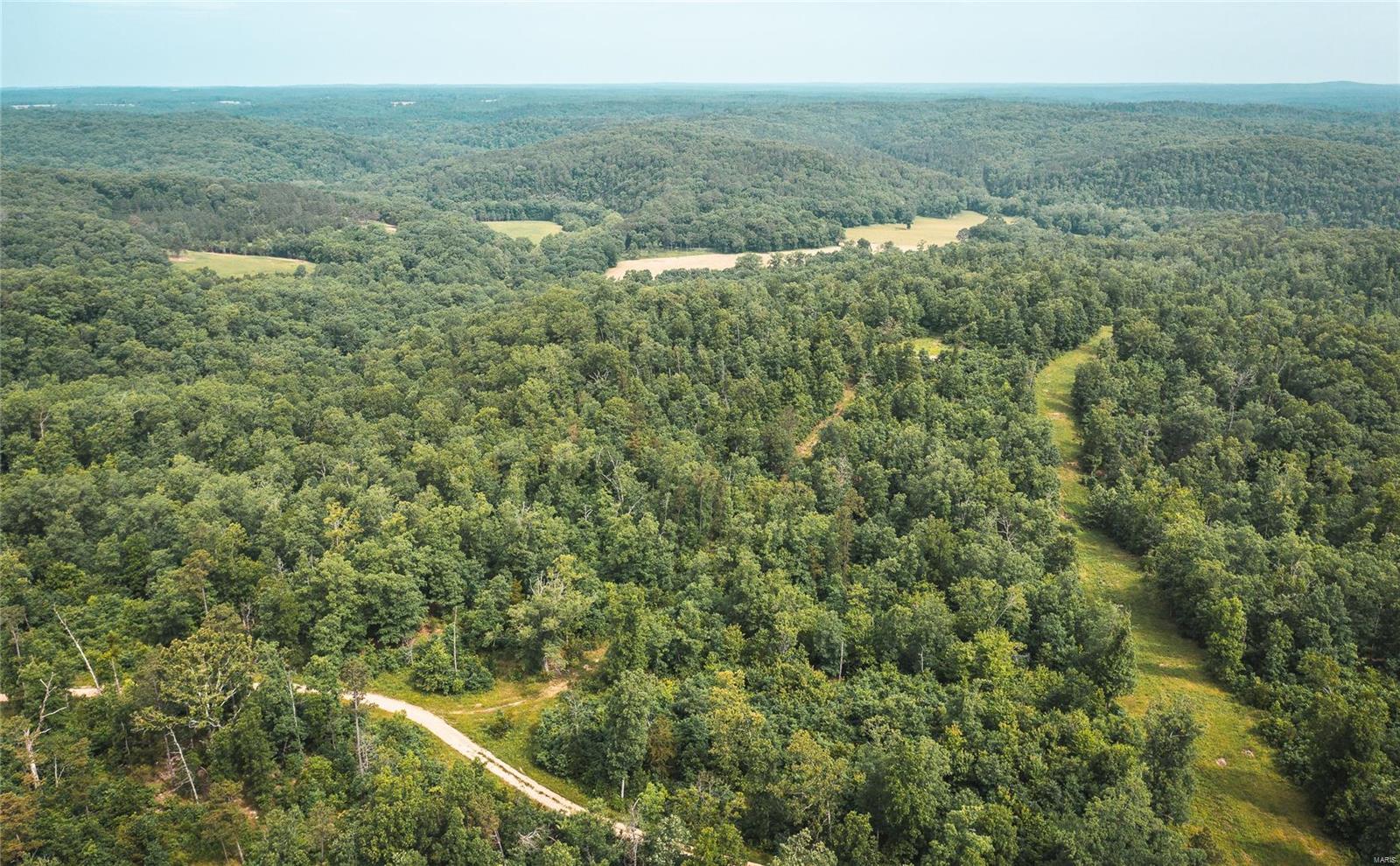 75.2 m/l acres of some of the Ozark's best views. Located in Texas County, Missouri this acreage offers Ashley Creek frontage and is just off of the gravel road. Close proximity to the Montauk State Park for excellent trout fishing. Deer and Turkey are frequent sights as Texas county is among the leading counties for whitetail. This area joins several larger land owners in some of the best managed whitetail hunting that Texas County has to offer. Numerous amounts of quality sheds were found while surveying the property & developing the road system. Private access roads have been rocked off of county road. Private access roads have been rocked off of county road.. Maps are for marketing only. All tracts are surveyed and will be recorded prior to closing. Owner is a licensed agent. Duplicate listing of 22040187.