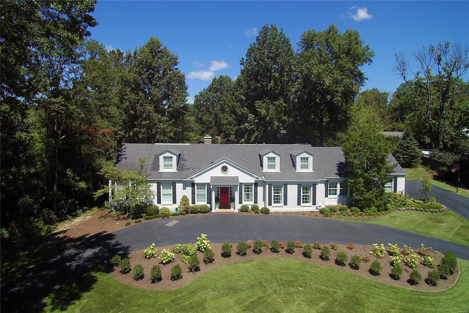 Situated on a beautifully landscaped 1-acre lot on desirable Clermont Lane, this 1.5-story home offers classic style & updated amenities. The entry foyer opens to the living & dining rms with elegant millwork & hardwood floors. Superb kitchen with KitchenAid, Dacor & Fisher Paykel appliances, plus center island & butler's pantry/wine bar. Convenient mud/laundry room has built-ins & a half bath. The hearth room has built-ins, gas fireplace and French doors to the terrace, yard & pool. Dream master suite renovation with master bedroom & sitting room, marble bath with separate vanities, a freestanding tub and luxury shower with digital Kohler system & multiple body sprays, plus 10' x 13' walk-in closet with island & organizers. The upper level has 3 bedrooms - one with en suite bath & two sharing a Jack & Jill bath, plus bonus room. Lots of natural light. Main & back staircase. Circle drive. Enjoy the heated pool with Pebble Tec surface, large terrace & professionally landscaped grounds. Additional Rooms: Mud Room