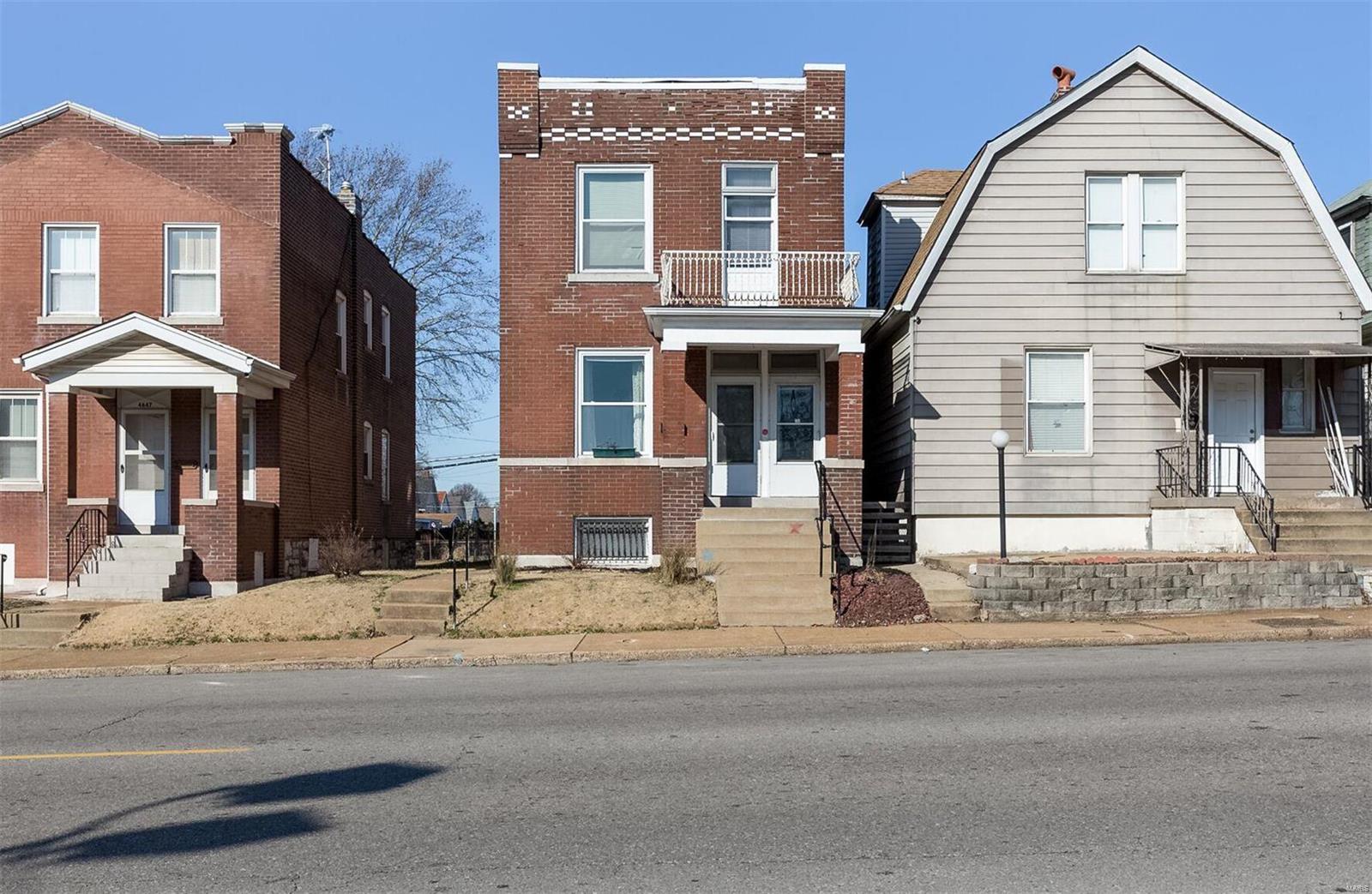 This is a 6 Room plus 2-Bathroom, Classic 2 Story Brick Home. It was converted from a 2 family and could easily be converted back. There are two electric panels, the previous upstairs kitchen water lines and drain were left inside the wall. Just close in the doorway leading upstairs and add a water heater. Kitchen has ceramic tile. This Home has Very Large Room Sizes with Hardwood Floors downstairs and carpeting upstairs. Newer Thermal Windows throughout. It Features All Original Woodwork, Original Closet and Bedroom Doors and Beautiful working Pocket Doors. The Plumbing and Electric have been updated. It comes with 4 Ceiling Fans and Roll up Blinds on most windows. There are 2 covered porches, a flat fully fenced yard and full walkout basement. Being Sold As Is. Seller willing to order Occupancy Inspection.