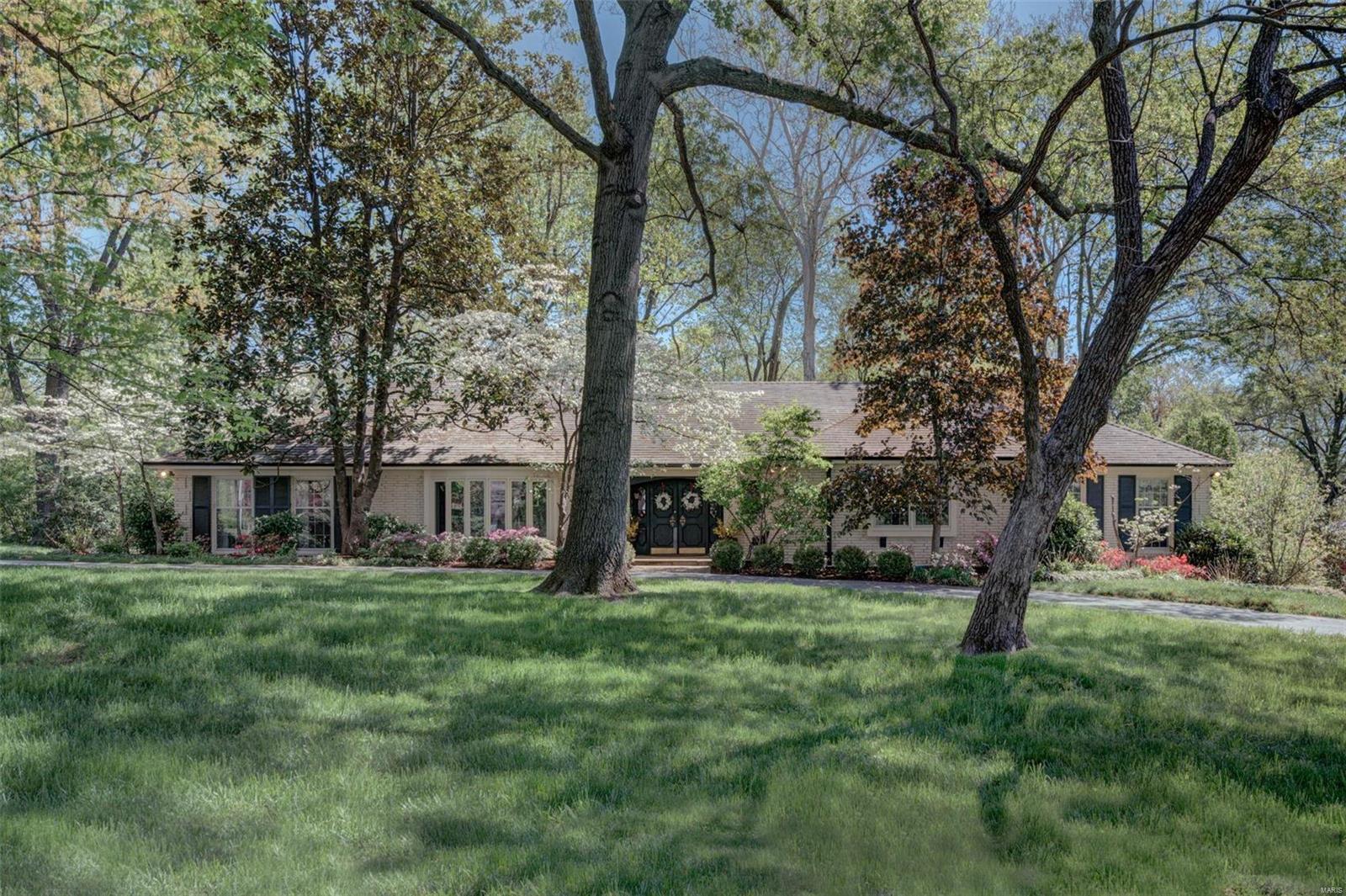 Fantastic  3 bed, 4.5 bath ranch home w/ 3850 sq ft of living space near Old Warson CC on gorgeous .75 acre. Features: hardwood floors, running plaster crown, millwork, updated full baths, recessed lights & speakers. Formal living rm w/ bow window & gas fireplace, dining room w/ china closet, & powder room. Enhanced original kitchen features: rare wood St. Charles cabinetry w/ metal accents, 5 burner Dacor cooktop, Subzero refrigerator, double SS KitchenAid wall ovens & dishwasher. Breakfast room overlooking rear terrace, hearth room w/ recessed work space & wet bar w/ under counter icemaker & wine refrigerator. Master suite w/ dressing room & bath w/ separate shower, air tub, marble surround & heated floors. Large secondary bedrooms & office finish main floor. LL w/ wet bar, full bath, family rm, sitting rm & rec rm walks out to terrace. Lots of finished & unfinished storage spaces. Oversized 2 car garage can be reconfigured to fit a golf cart. Ultra private backyard! Must see!