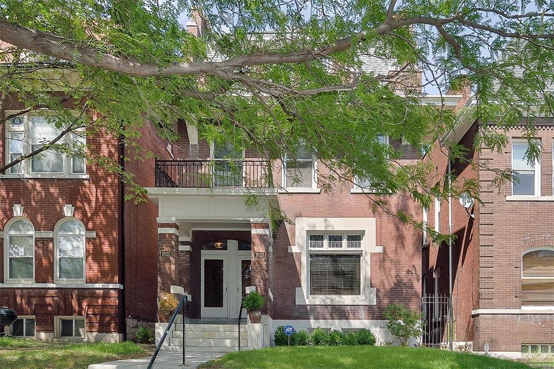 What a rare opportunity to own a large 2.5 story two family home with a completely renovated 3 bedroom 2 bath owner's unit!!   This building features well over 3,700  square feet total with an expansive, 2nd floor townhome, and a large two bedroom first floor apartment to help supplement payments.  This home features exquisite, original millwork, pocket doors, grand staircase, beautiful mantels and large living spaces with refinished hardwood flooring throughout.  Kitchen is very spacious with a beautiful gourmet cook's kitchen, fantastic stainless island, high end appliances and a gorgeous walk out privacy deck.  Bathrooms have been updated with beautiful natural marble finishes. First floor has long term tenant that is month to month, paying $650.00.  First floor will need some paint and sweat equity but could rent for much more, as a large two bedroom unit!  This two family home is conveniently nestled between Lafayette Square, Soulard and Downtown along with major highways.