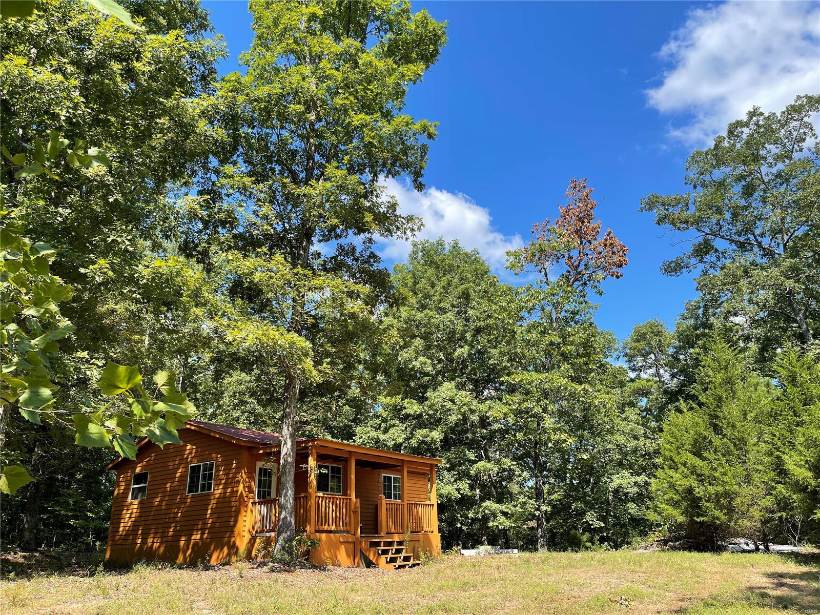 RUSTIC HUNTING CABIN ON 48.8 ACRES OF WOODS: Located in Southwest Madison County, this 600 sq. ft. rustic hunting cabin has cedar and drywall already finished inside, some plumbing roughed in and partially wired. There's not a well, septic or electric in place but it's ready for someone else to finish. This is a perfect get-a-way for the weekender, or a great hunting cabin secluded back in the woods. There's a deeded easement into the property off a county-maintained road. This property is only a few minutes from the St. Francis River and even closer to a country store.